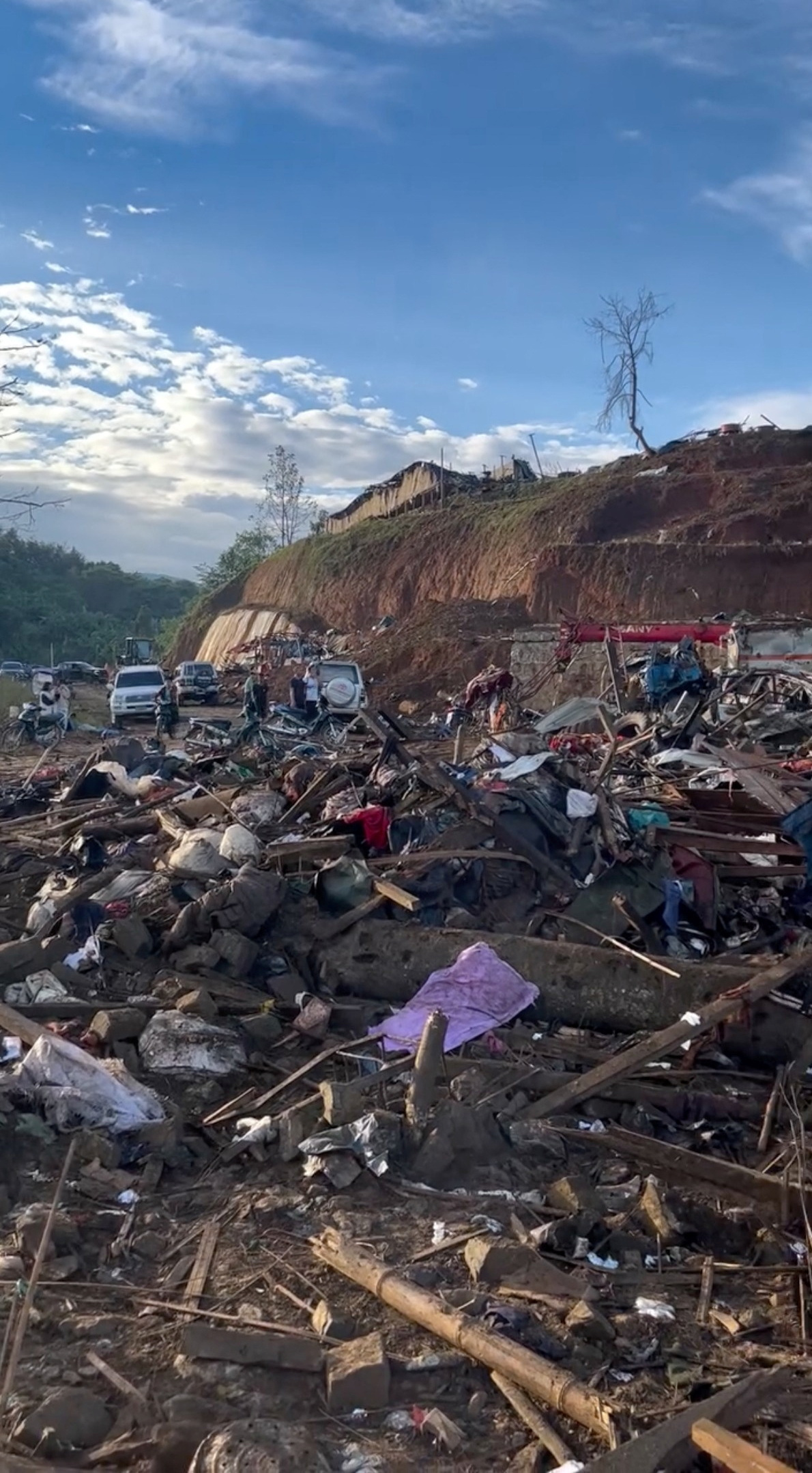 Debris in the refugee camp In Laiza after the military attack [Social media video via Reuters]