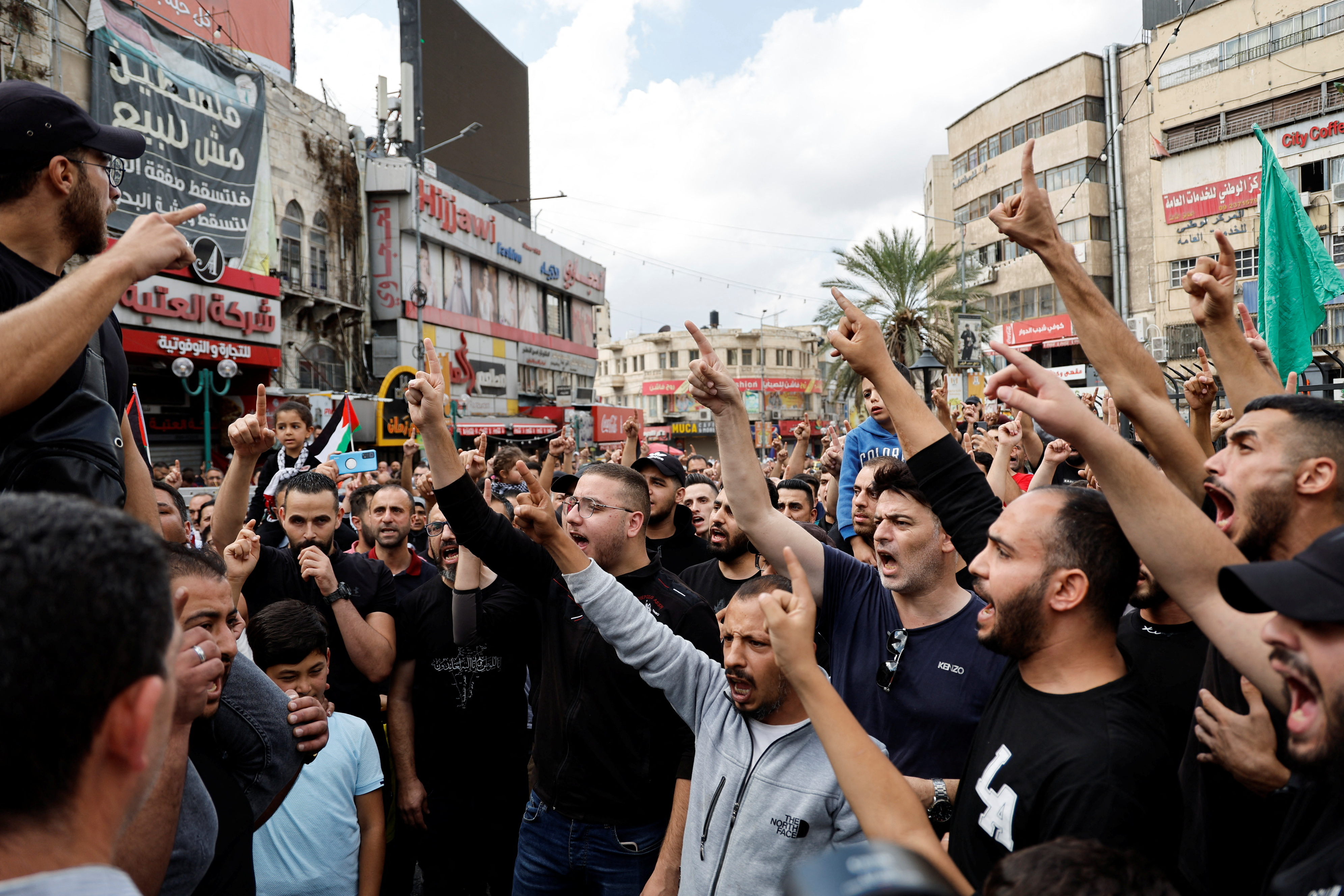 Palestinians take part in a protest in support of the people in Gaza, after hundreds of Palestinians were killed in a blast at al-Ahli Hospital in Gaza that Israeli and Palestinian officials blamed on each other, in Nablus in the Israeli-occupied West Bank October 18, 2023