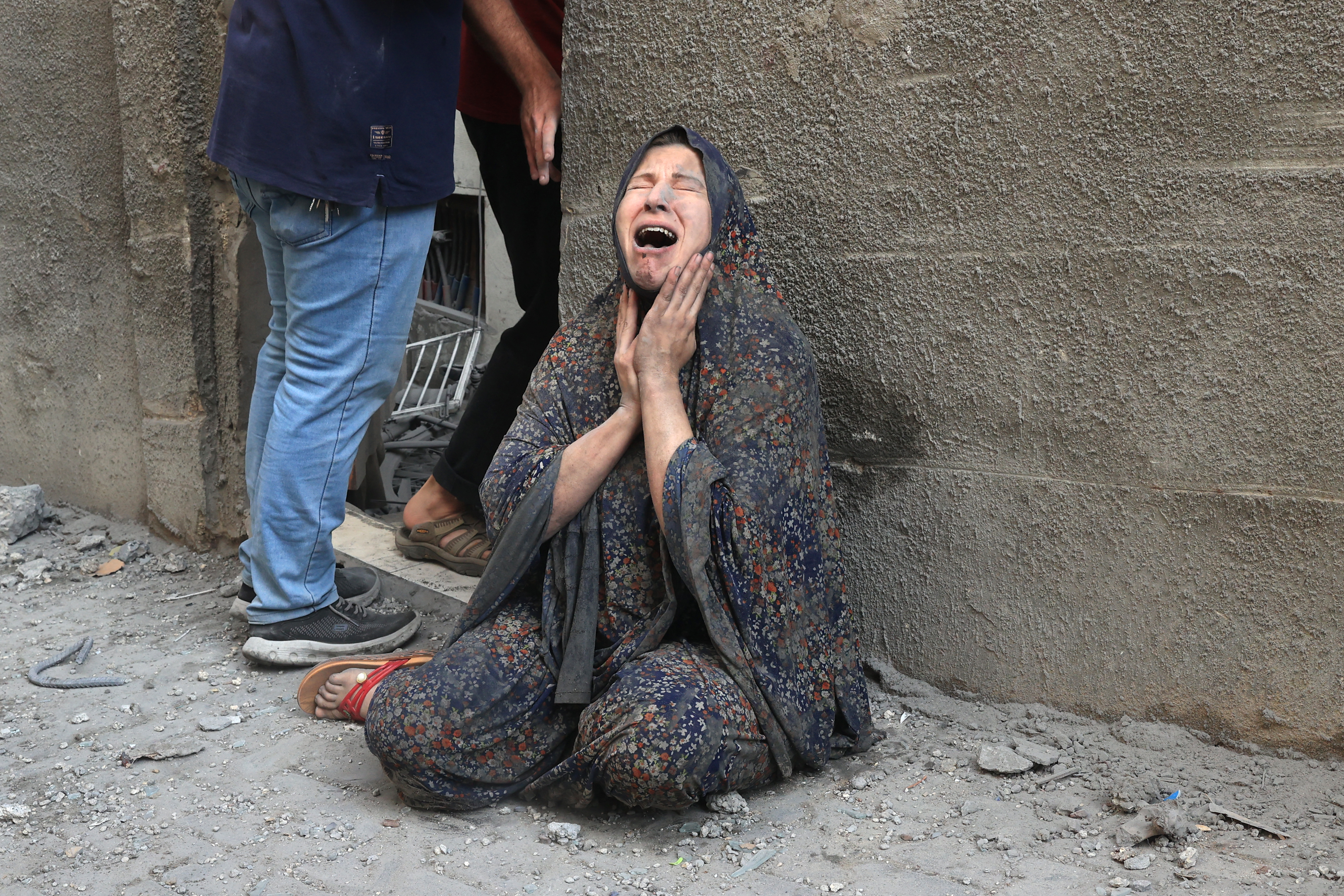 A Palestinian woman reacts after an Israeli airstrike on the Rafah refugee camp