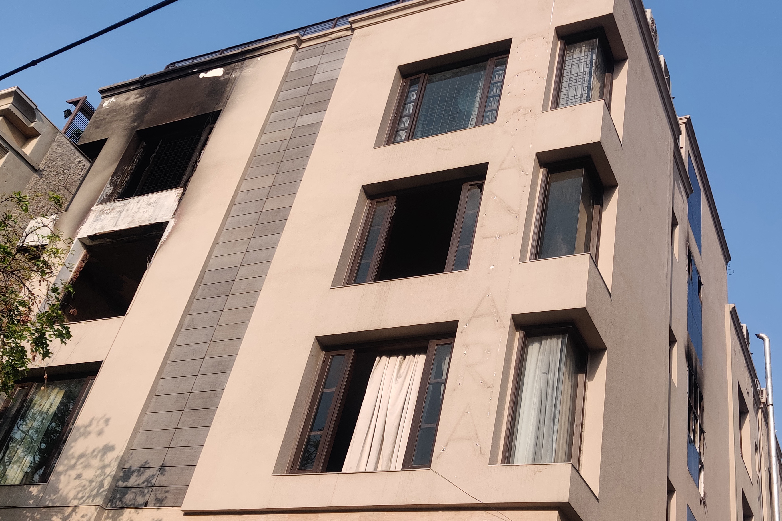 The front facade of Antara Care Home for Seniors' four-storey building. Visible in this image are the two rooms on the 3rd floor (301 on the right and 302 on the left) where fire raged and killed two elderly women in Delhi, India