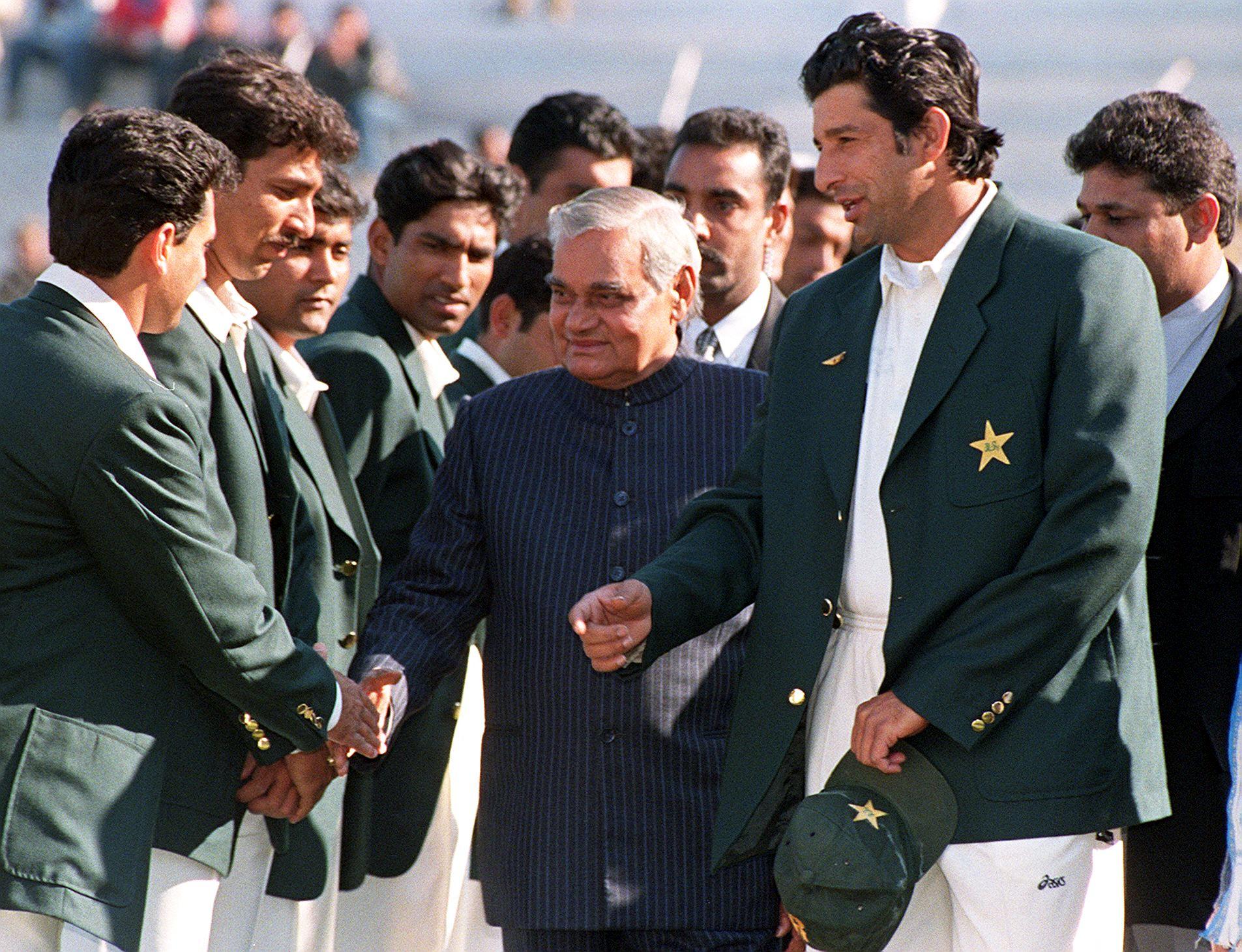 Pakistan’s captain Wasim Akram, right, introduces the members of his team to Indian Prime Minister Atal Bihari Vajpayee, centre, prior to the start of a Test match in 1999