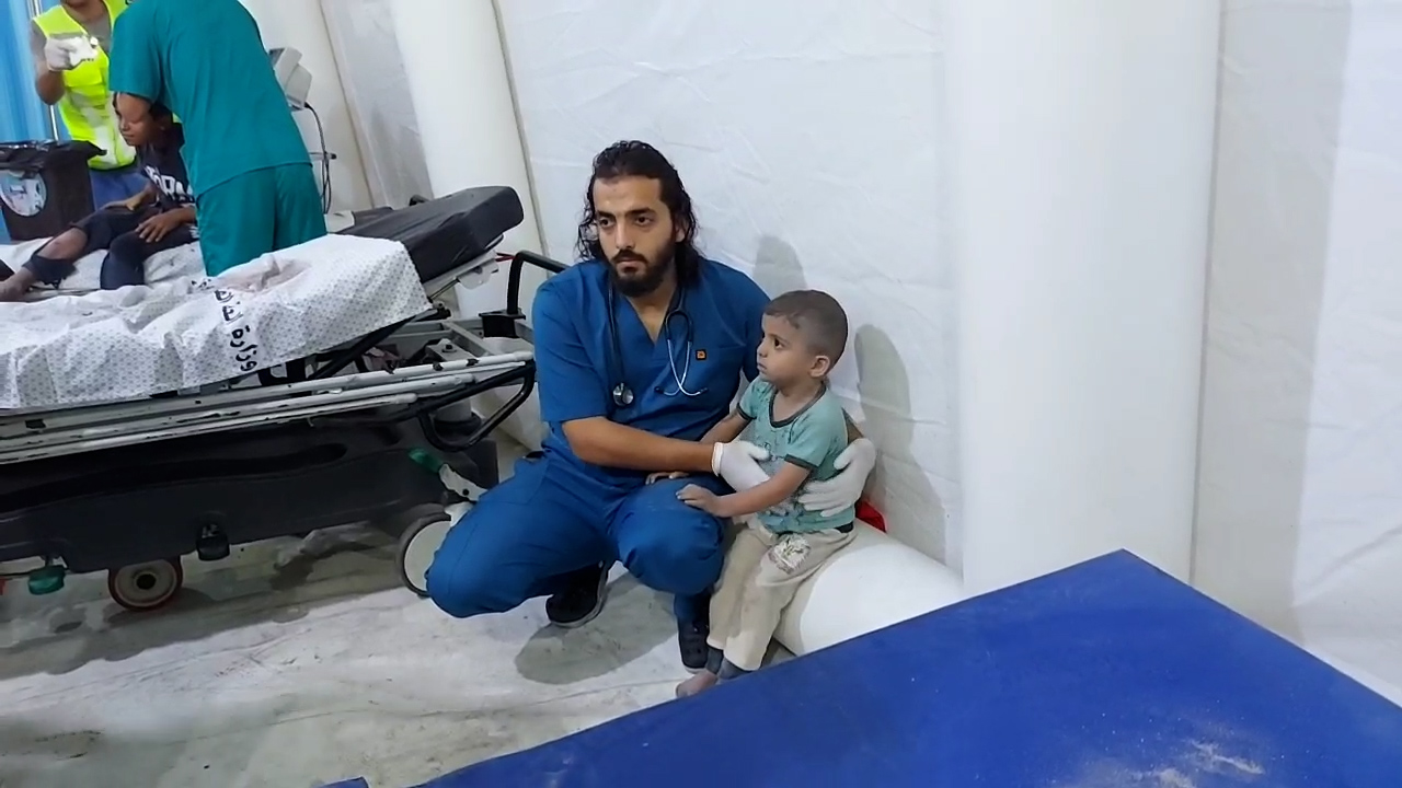 Doctors tried to comfort this Palestinian boy who was showing signs of shock after an Israeli attack in Rafah in southern Gaza.