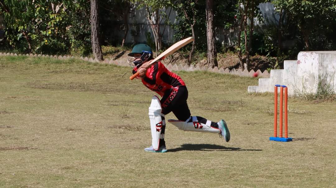 One of the girls takes a swing at the ball [Photo courtesy of Ayaz Naik]