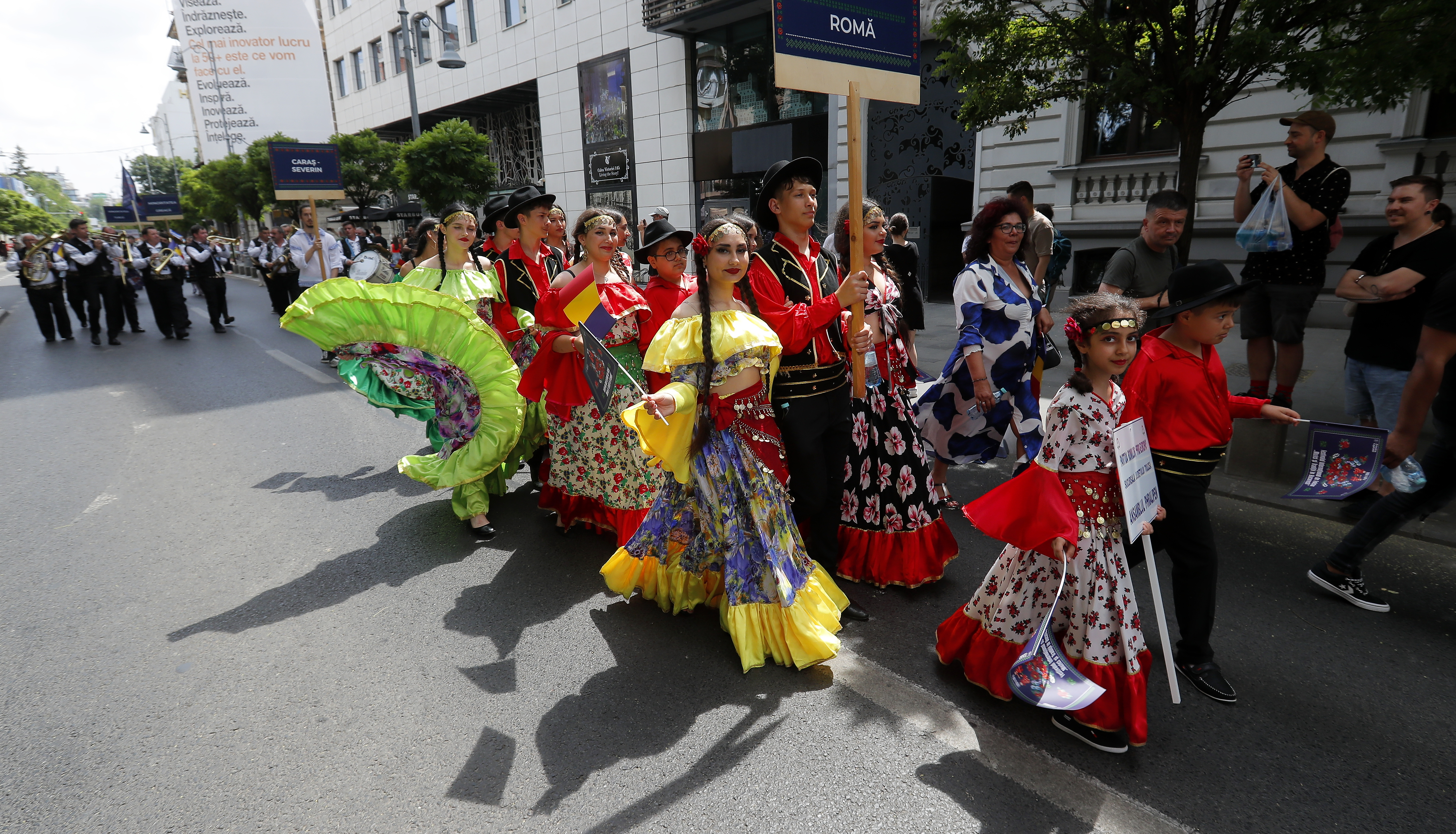 Ethnic Roma people wear traditional clothing during the parade of the International Folklore Festival ‘Music and Traditions in Bucharest 2023’ in downtown Bucharest, Romania, on June 17, 2023