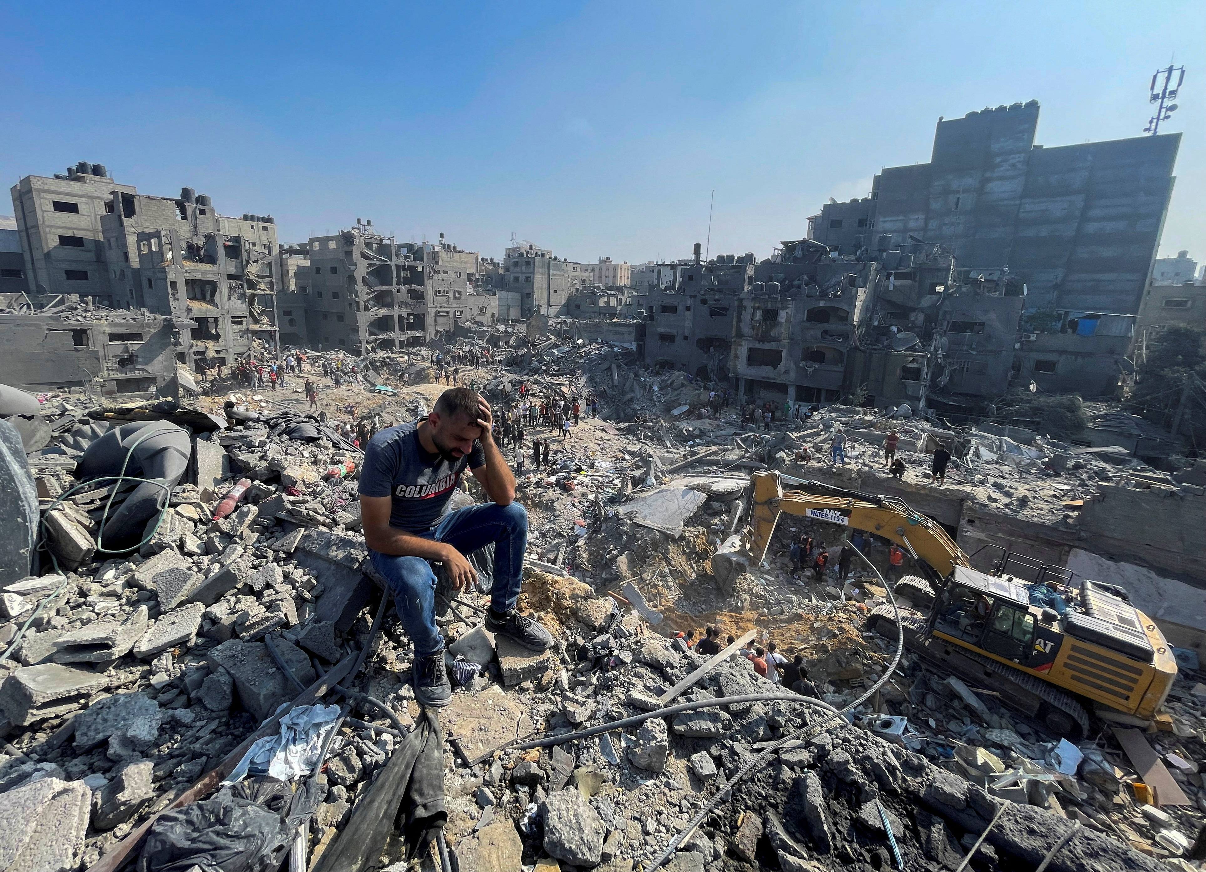 A man reacts as Palestinians search for casualties a day after Israeli strikes on houses in Jabalia refugee camp in the northern Gaza Strip