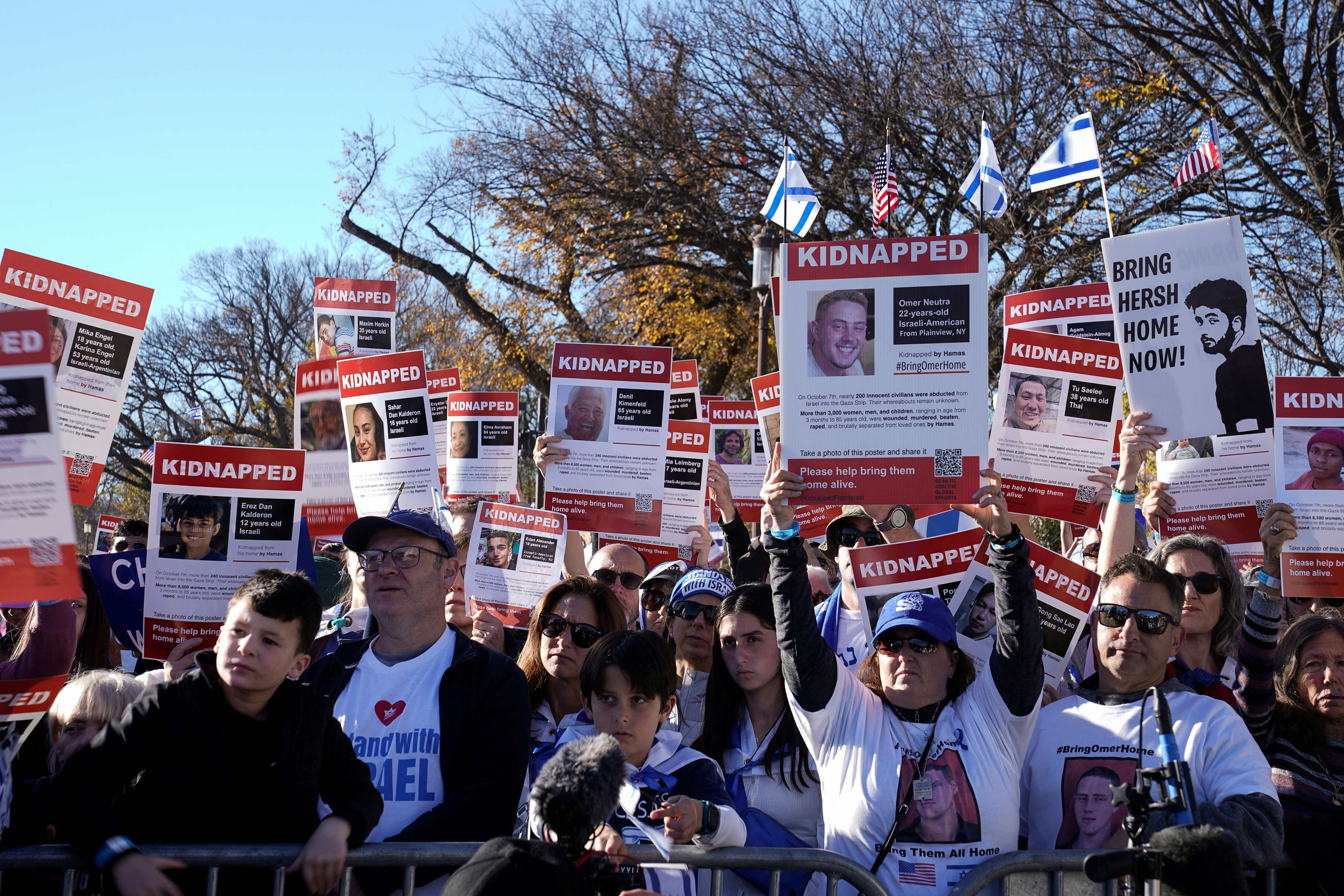 The crowd shouted ‘Bring them home!’ as they held aloft photos of the more than 200 people taken captive