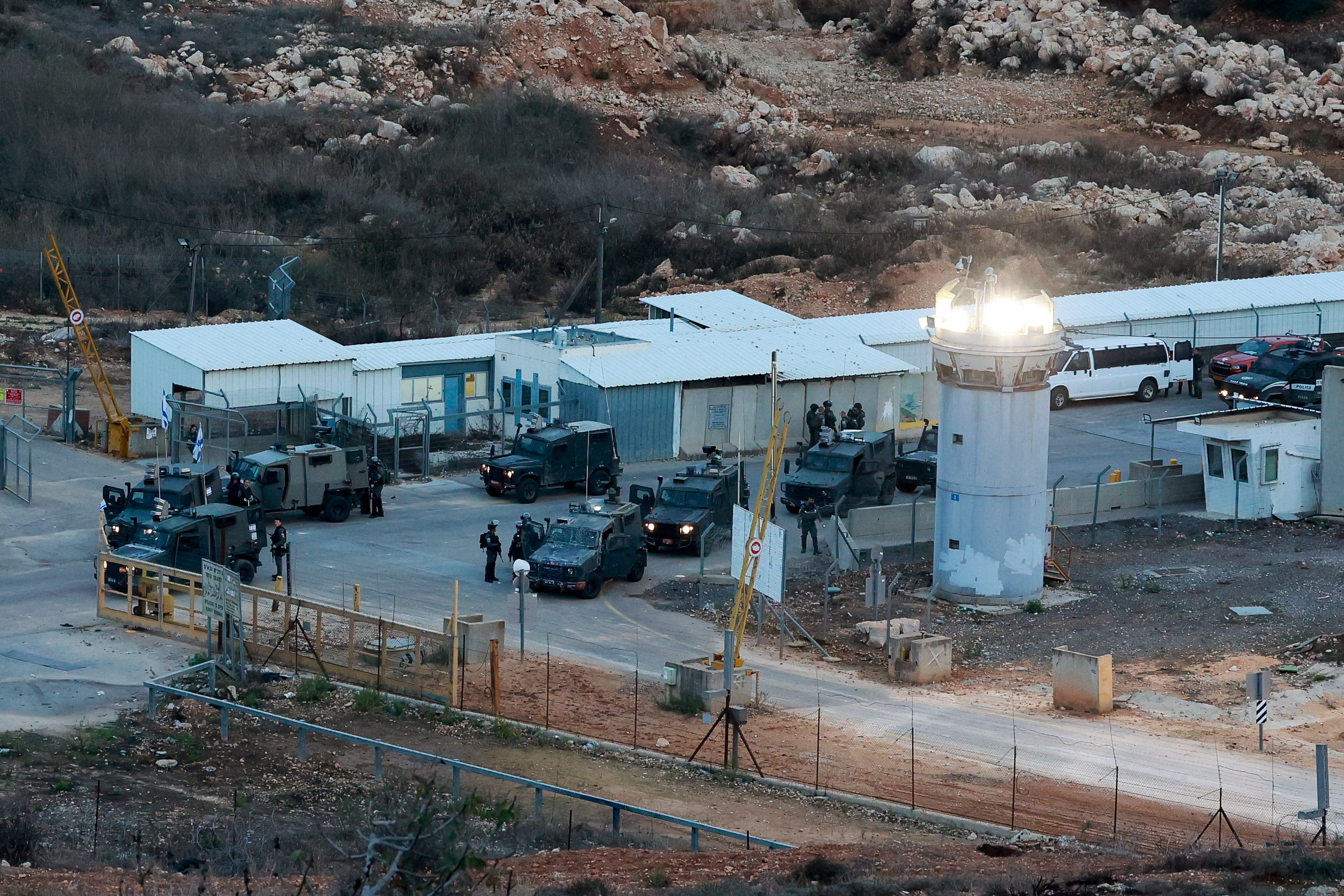 Army members standby near the Israeli military prison, Ofer, near Ramallah, in the Israeli-occupied West Bank, where some Palestinian prisoners are expected to be released as part of the Israel-Hamas deal to free hostages held in Gaza in exchange for the release of Palestinian prisoners