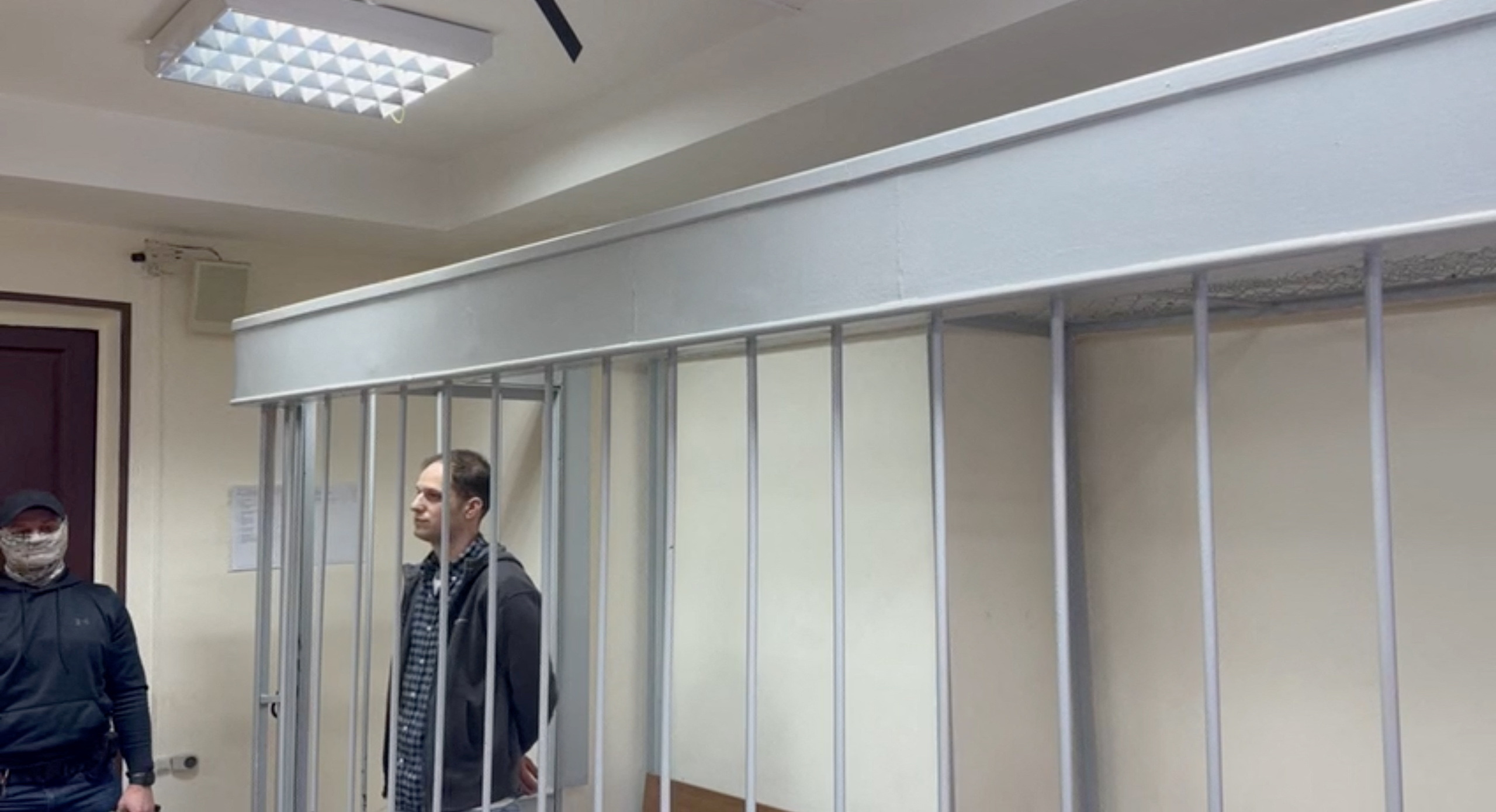 Wall Street Journal reporter Evan Gershkovich attends a court hearing on the extension of pre-trial detention on espionage charges in Moscow, Russia November 28, 2023, in this still image taken from video. Moscow General Jurisdiction Courts Press Service/Handout via REUTERS ATTENTION EDITORS - THIS IMAGE HAS BEEN SUPPLIED BY A THIRD PARTY. NO RESALES. NO ARCHIVES. MANDATORY CREDIT.
