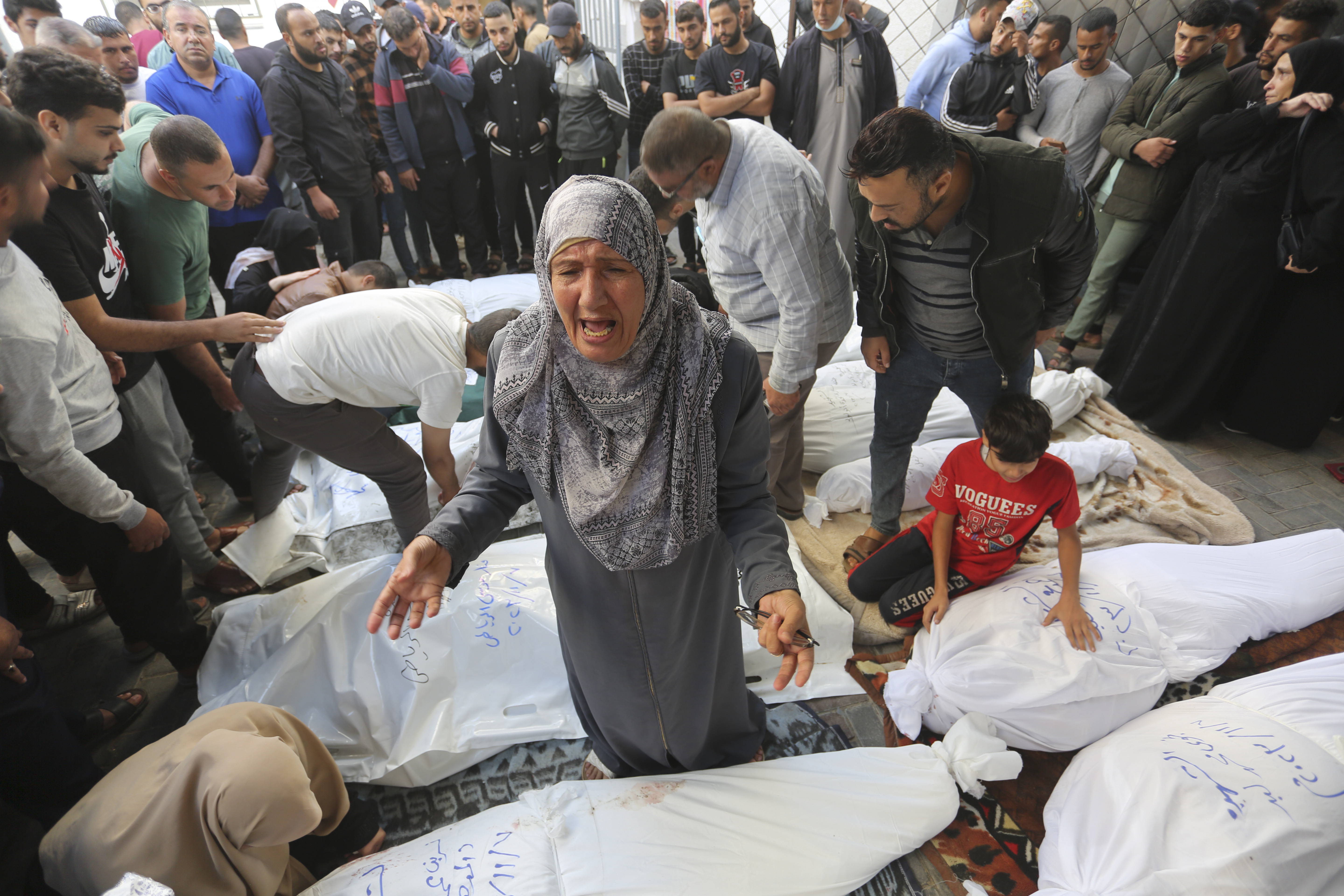 Palestinians mourn their relatives killed in the Israeli bombardment of the Gaza Strip in Rafah.