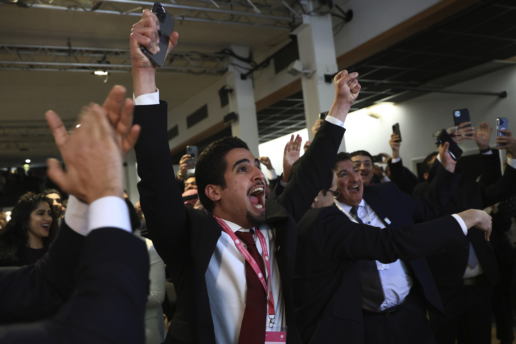 Members of the Saudi delegation celebrate as the BIE announces the vote on November 28, 2023, in Issy-les-Moulineaux outside Paris, France