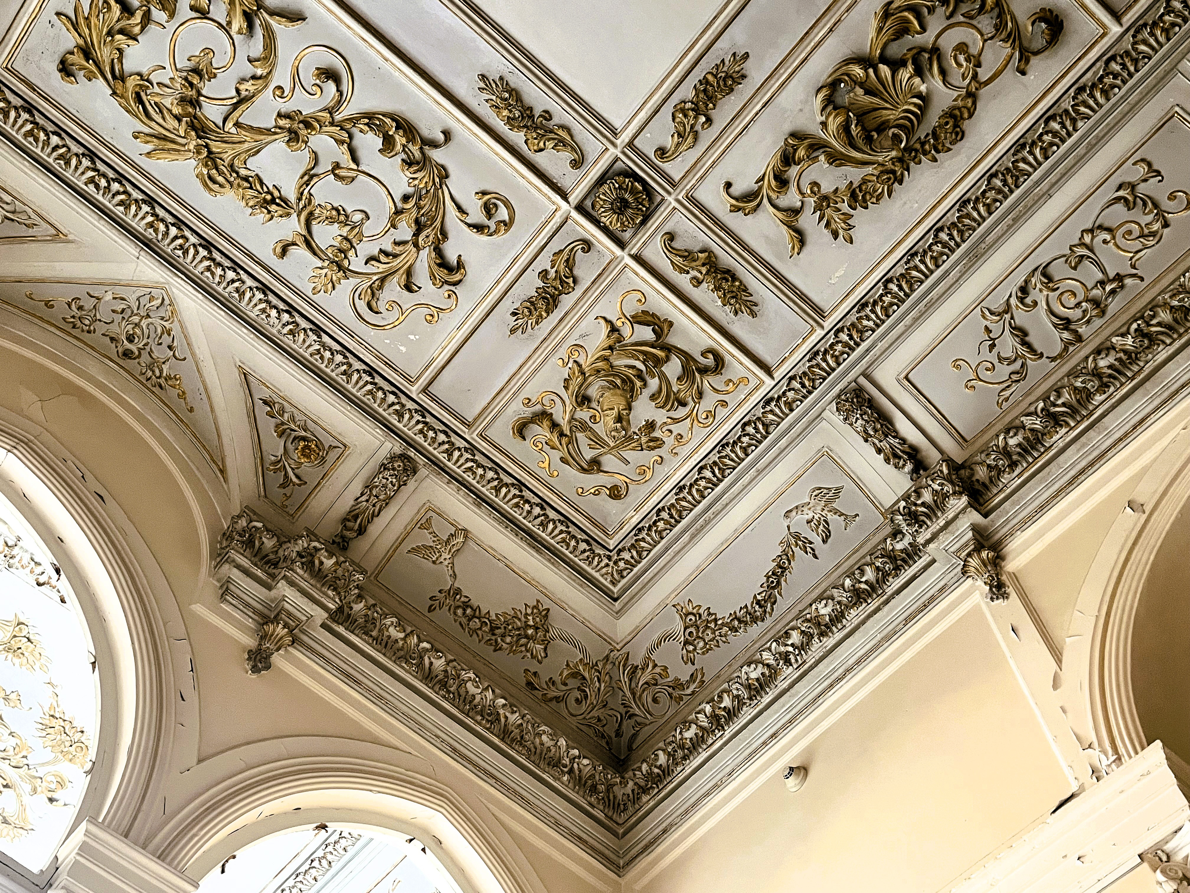 Detailed gold stucco adorns every ceiling of the villa