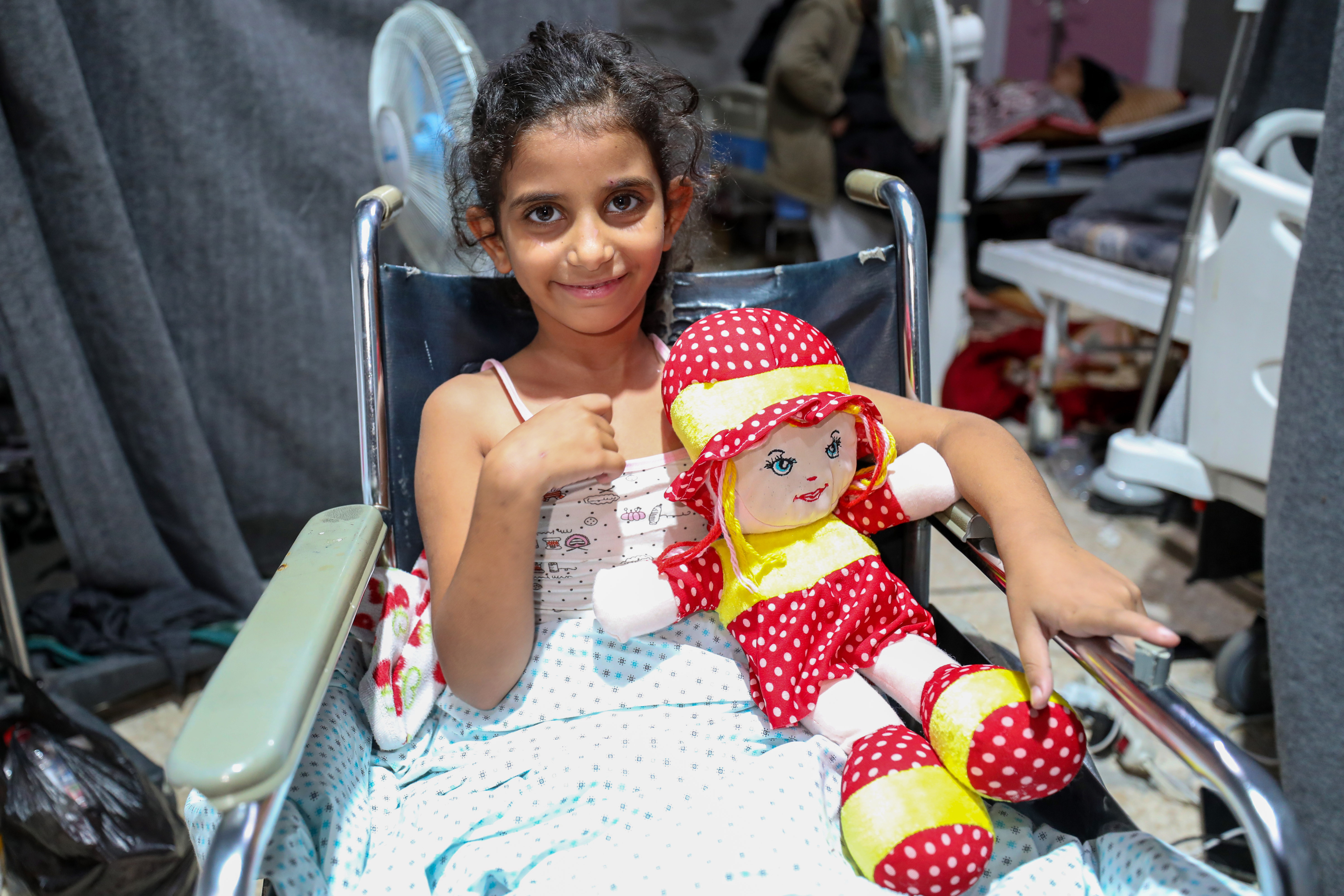 Hayat Miqbil, seven, suffered two broken legs after an Israeli missile targeted her family home in Nuseirat refugee camp
