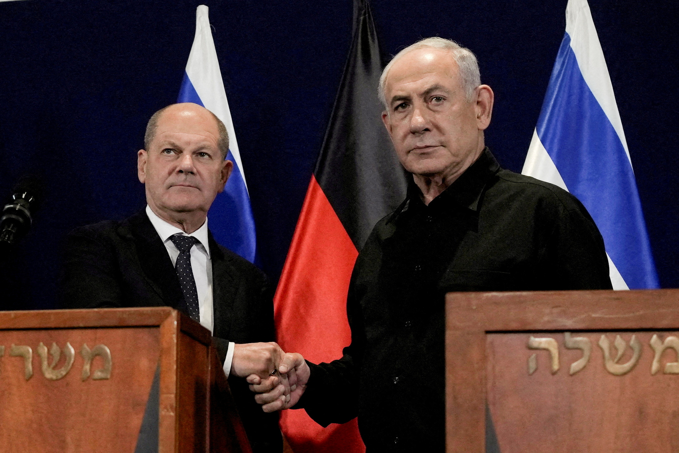 German Chancellor Olaf Scholz, left, shakes hands with Israeli Prime Minister Benjamin Netanyahu, during a press conference in Tel Aviv, Israel, Tuesday, Oct. 17, 2023. Maya Alleruzzo/Pool via REUTERS TPX IMAGES OF THE DAY