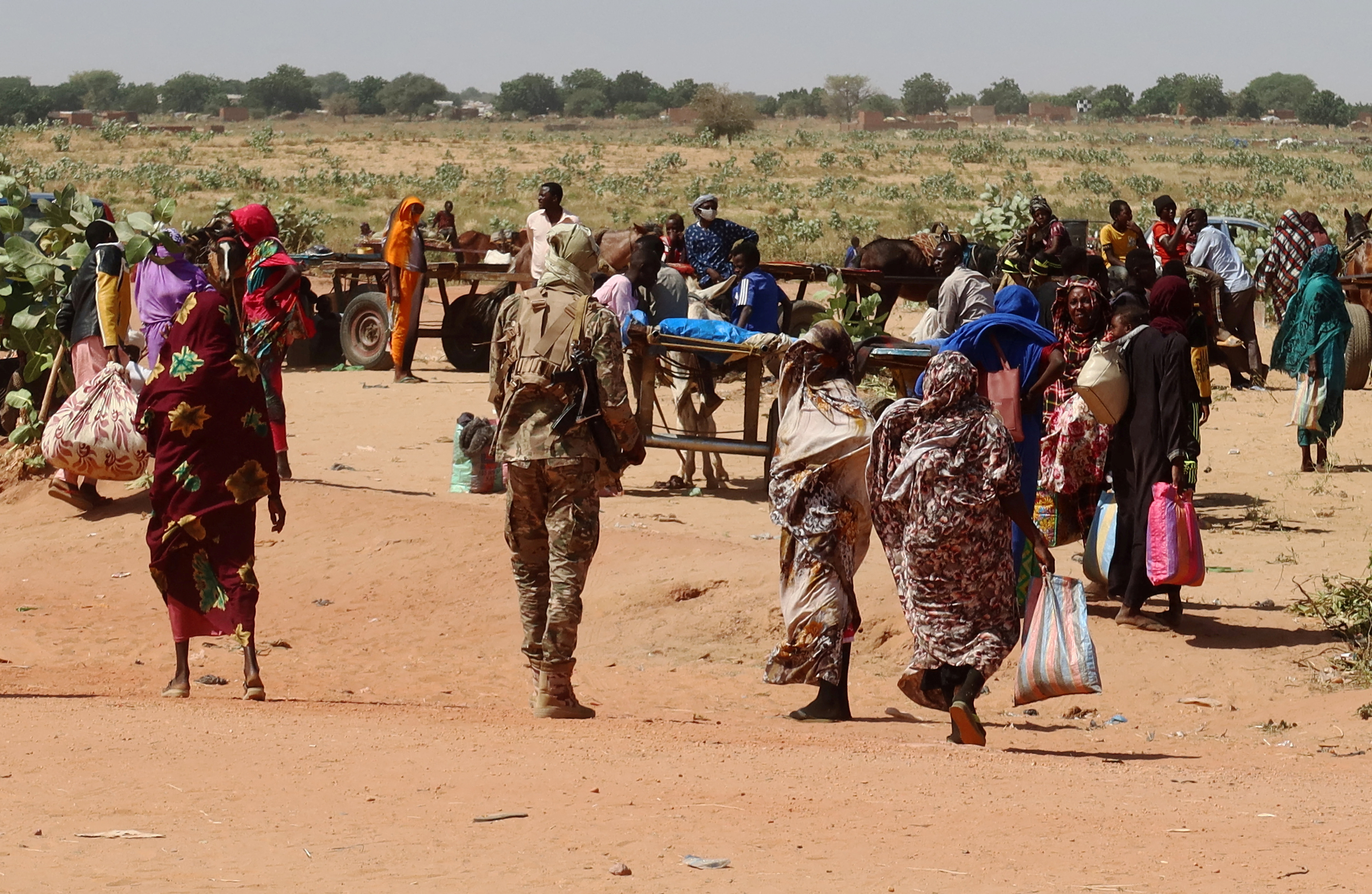 Families escaping violence in Ardamata, West Darfur, cross into Adre, Chad, November 7, 2023. Survivors told of executions and looting, which they said were carried out by RSF and allied militias