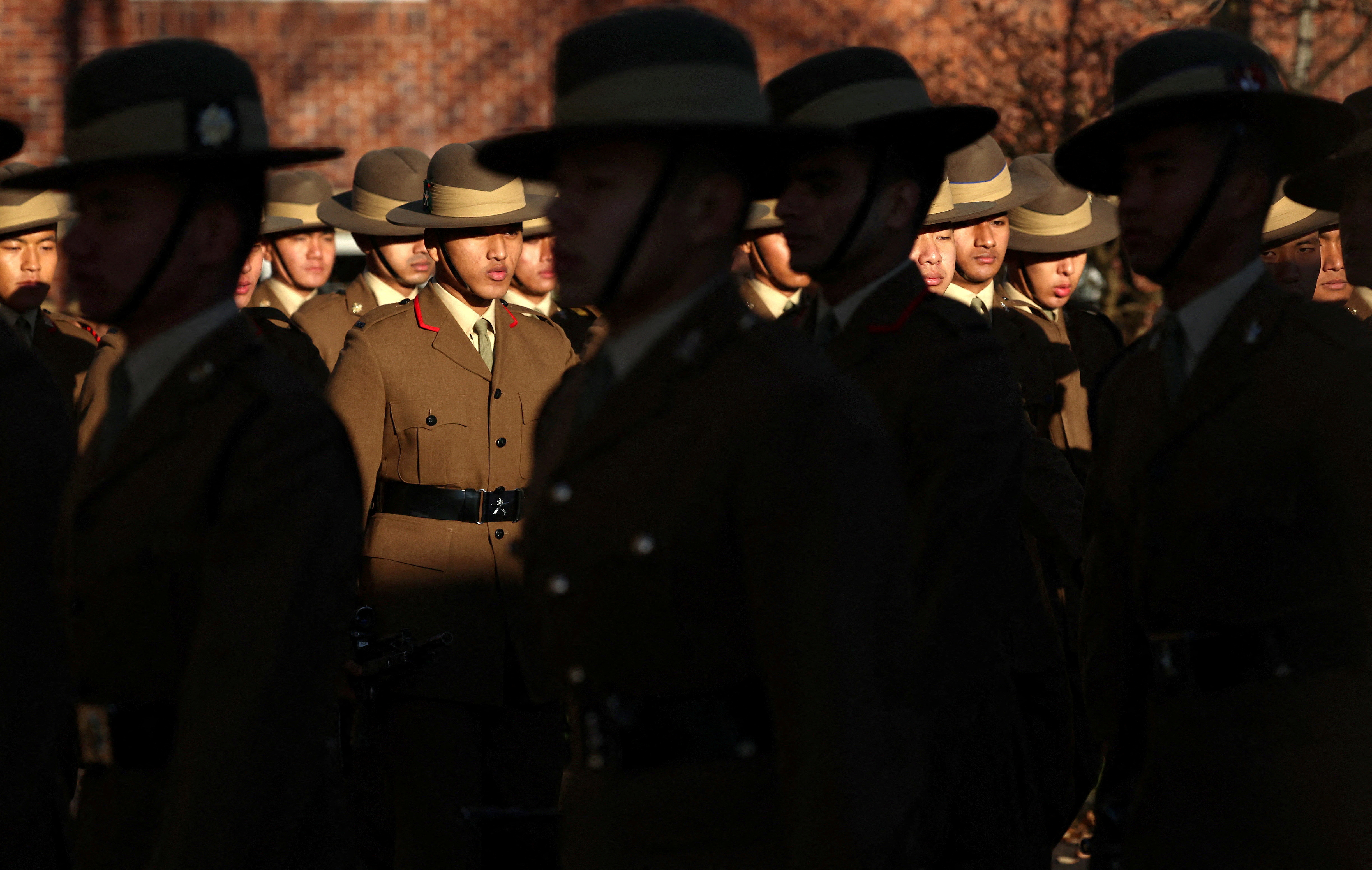 Soldiers from the Brigade of Gurkhas march on the Parade Ground during a passing out ceremony at Catterick Garrison near Richmond, Britain