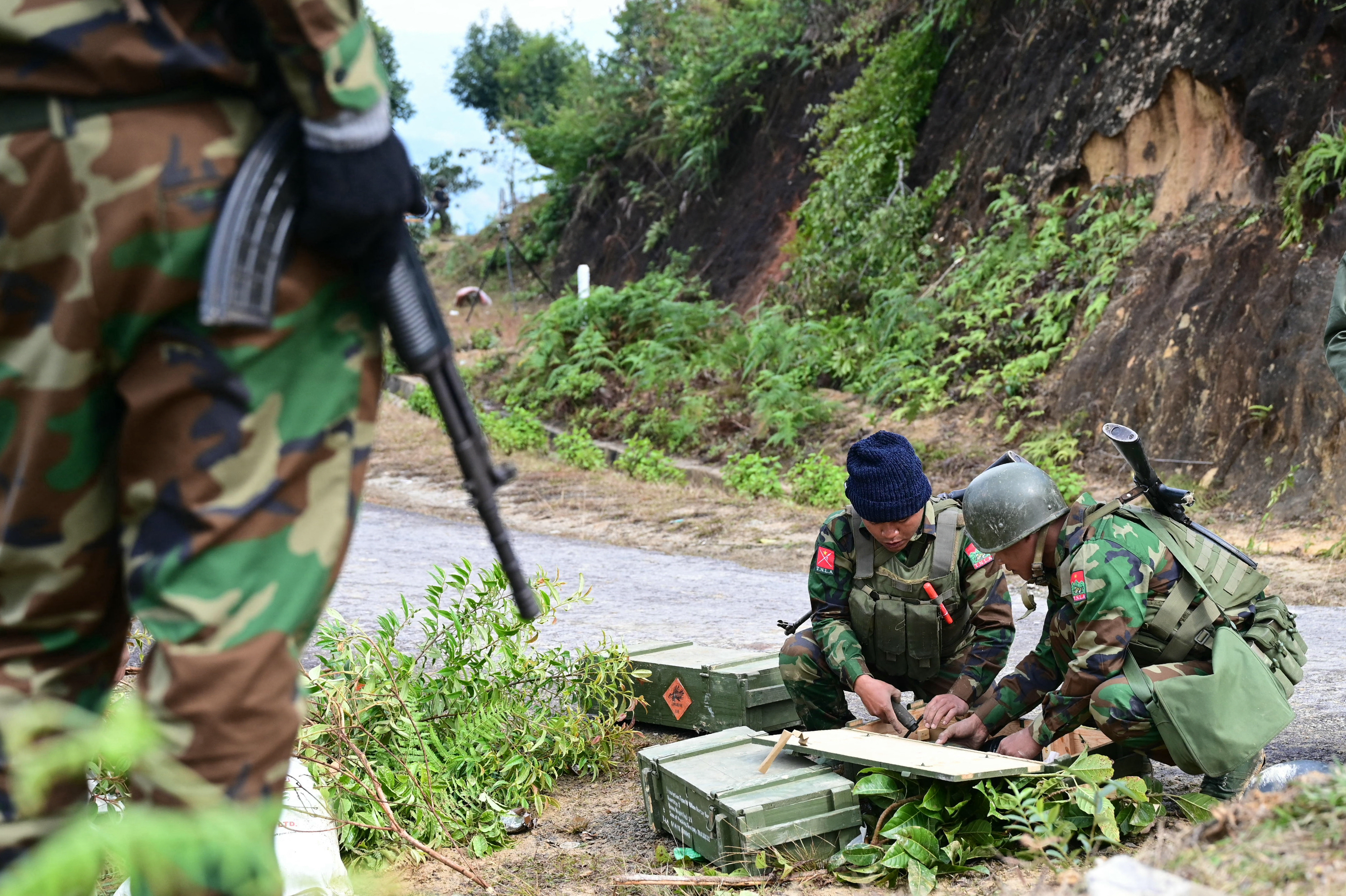 Ta'ang National Liberation Army (TNLA) preparing their weapons.