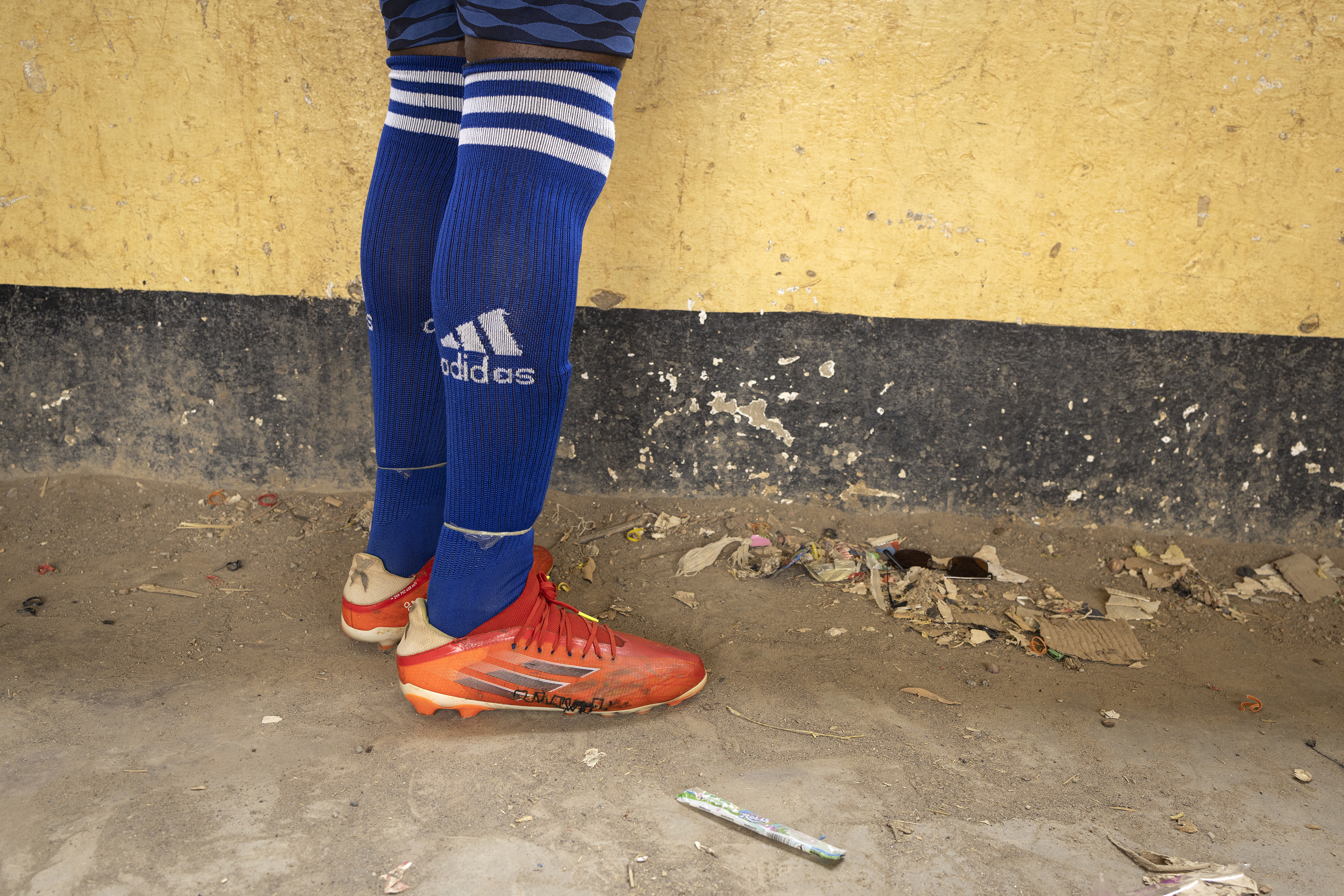 Player Gift Mukanya managed to get his damaged football boot hand-stitched at the local market in Meheba