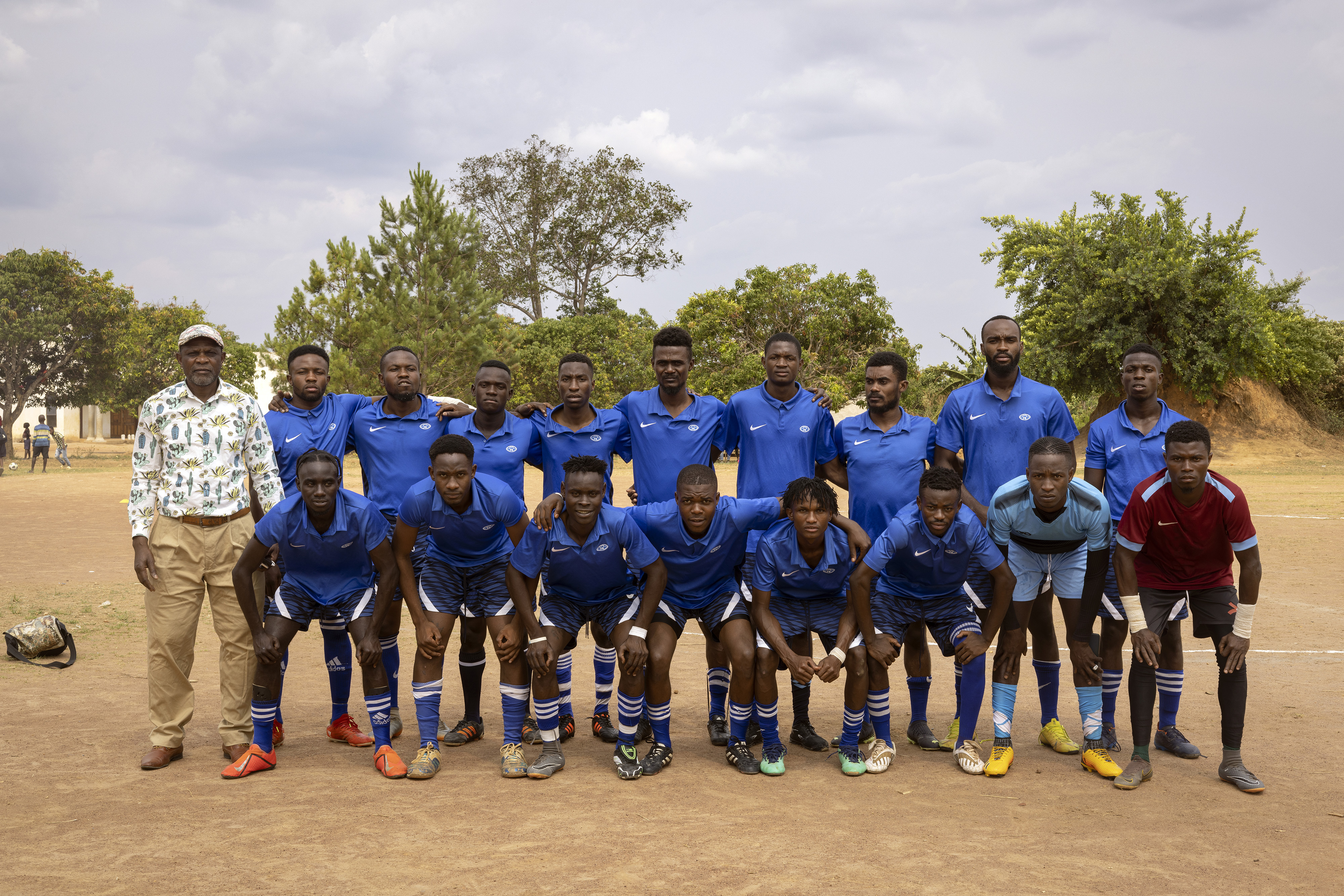 The Meheba Academy FC team poses ahead of their game against Mushindamo Bullets. The team includes refugees from the DRC, Angola, Mozambique, Rwanda, and Somalia as well as some local Zambians who live in the settlement