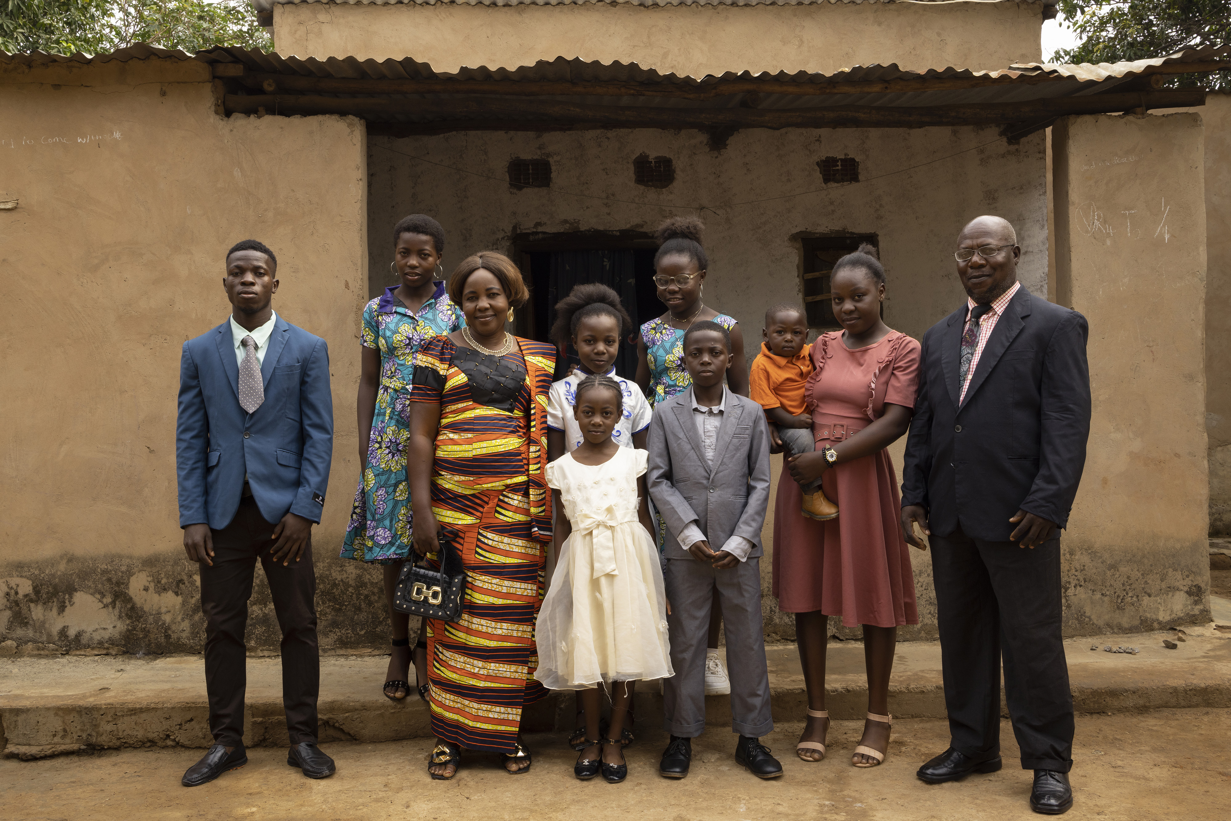 Nathan, left, his parents, siblings and baby nephew get ready to go to church on a Sunday morning. The family fled violence in the DRC in 2004