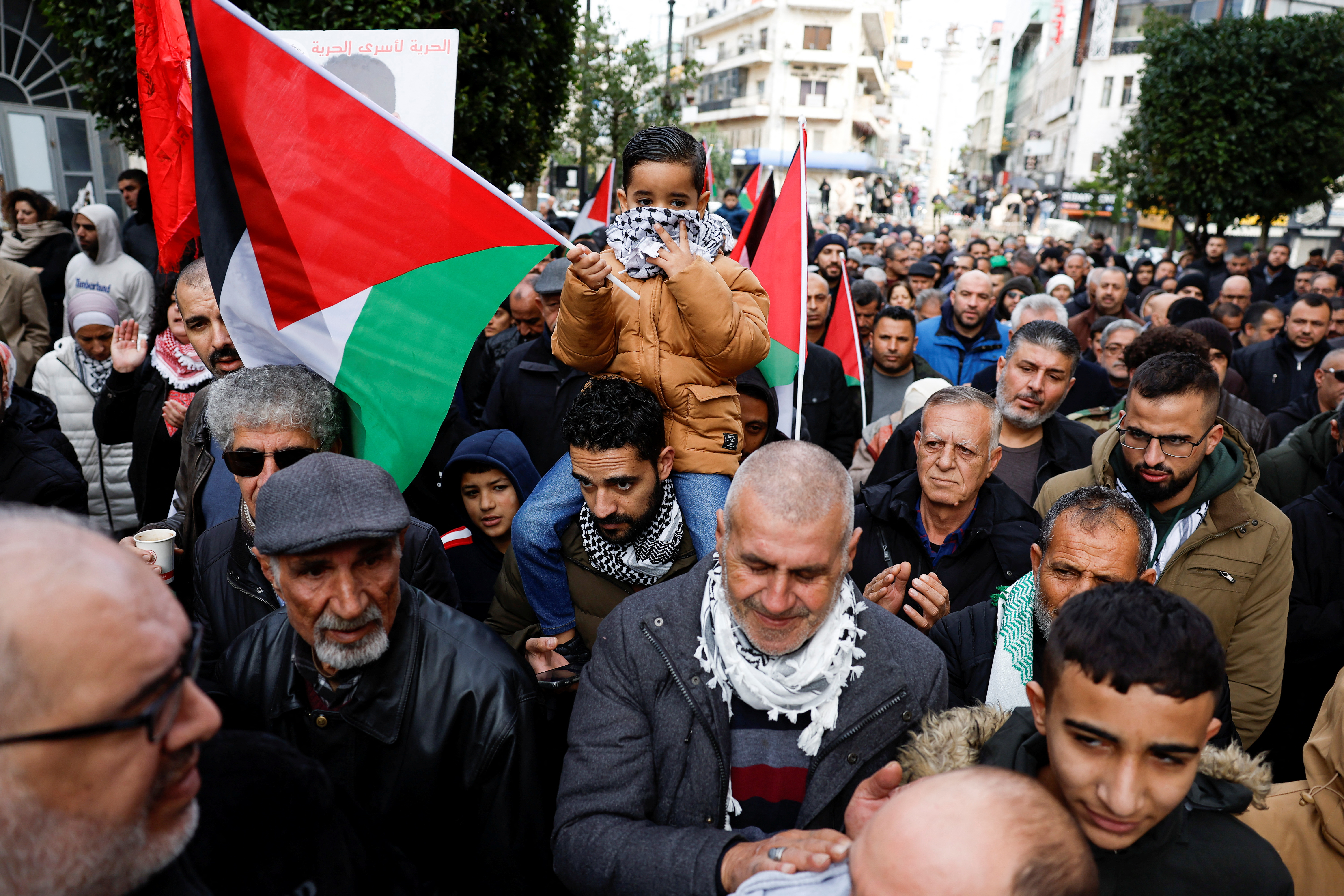 Palestinians attend a protest against the killing of senior Hamas official, Saleh al-Arouri, in Ramallah in the Israeli-occupied West Bank on January 3, 2024