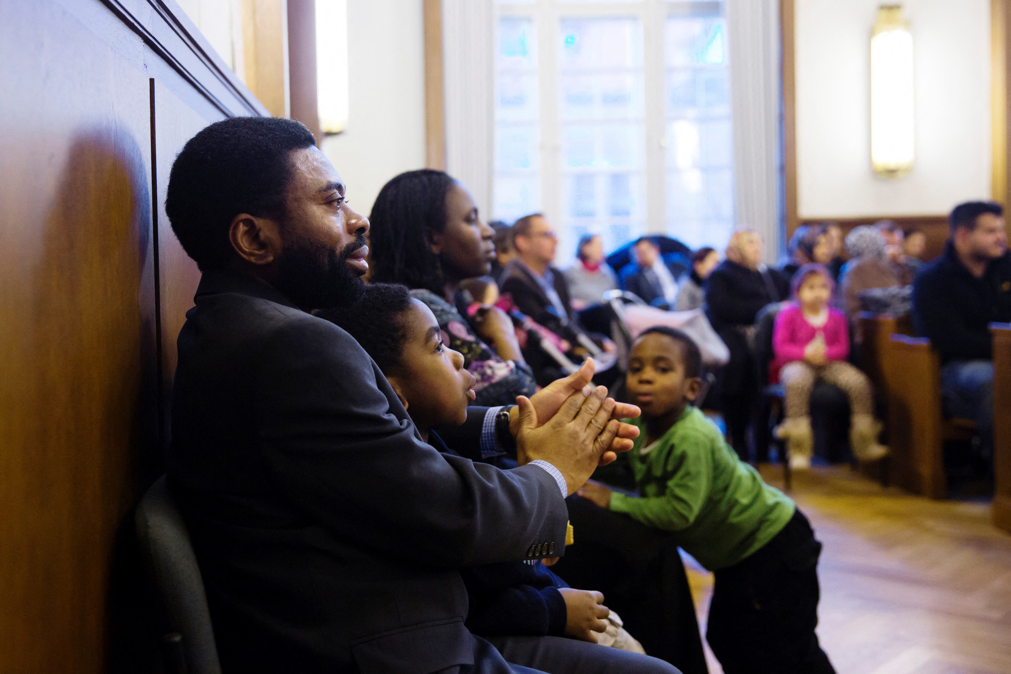 People wait to be naturalised as Germans 