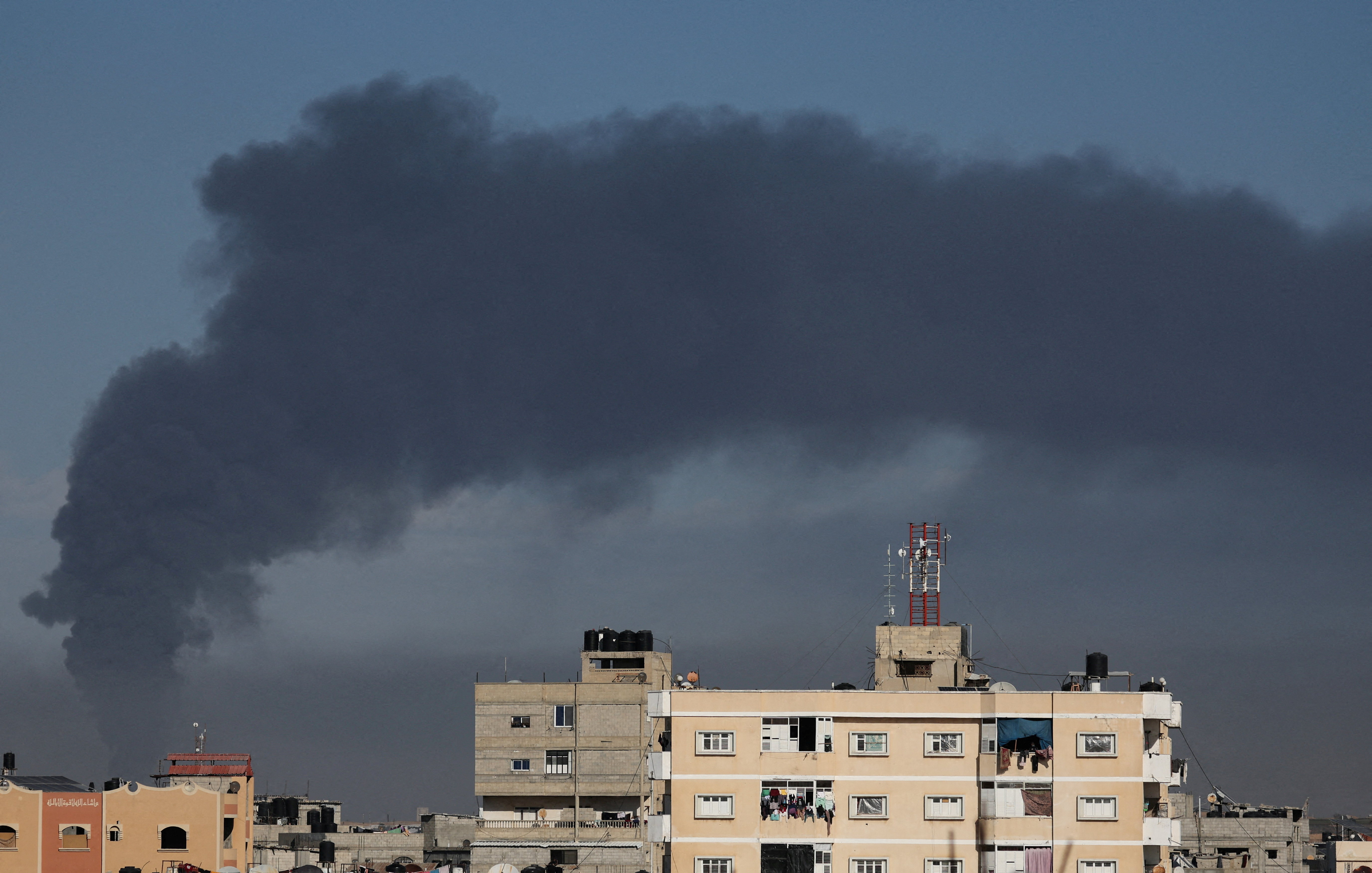 Smoke rises amid Gaza buildings