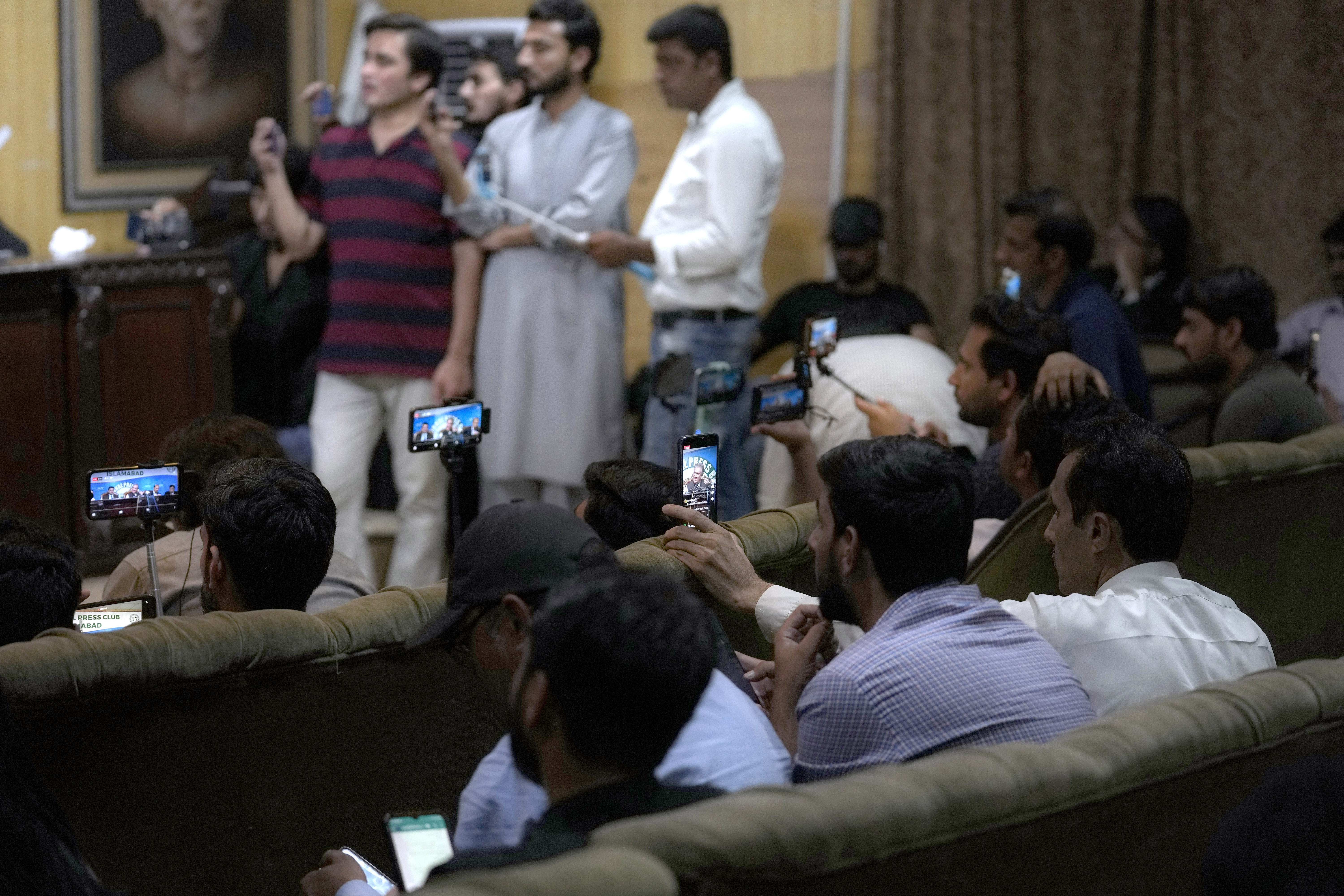 Journalists at a news conference with Shah Mahmood Qureshi, a top PTI leader
