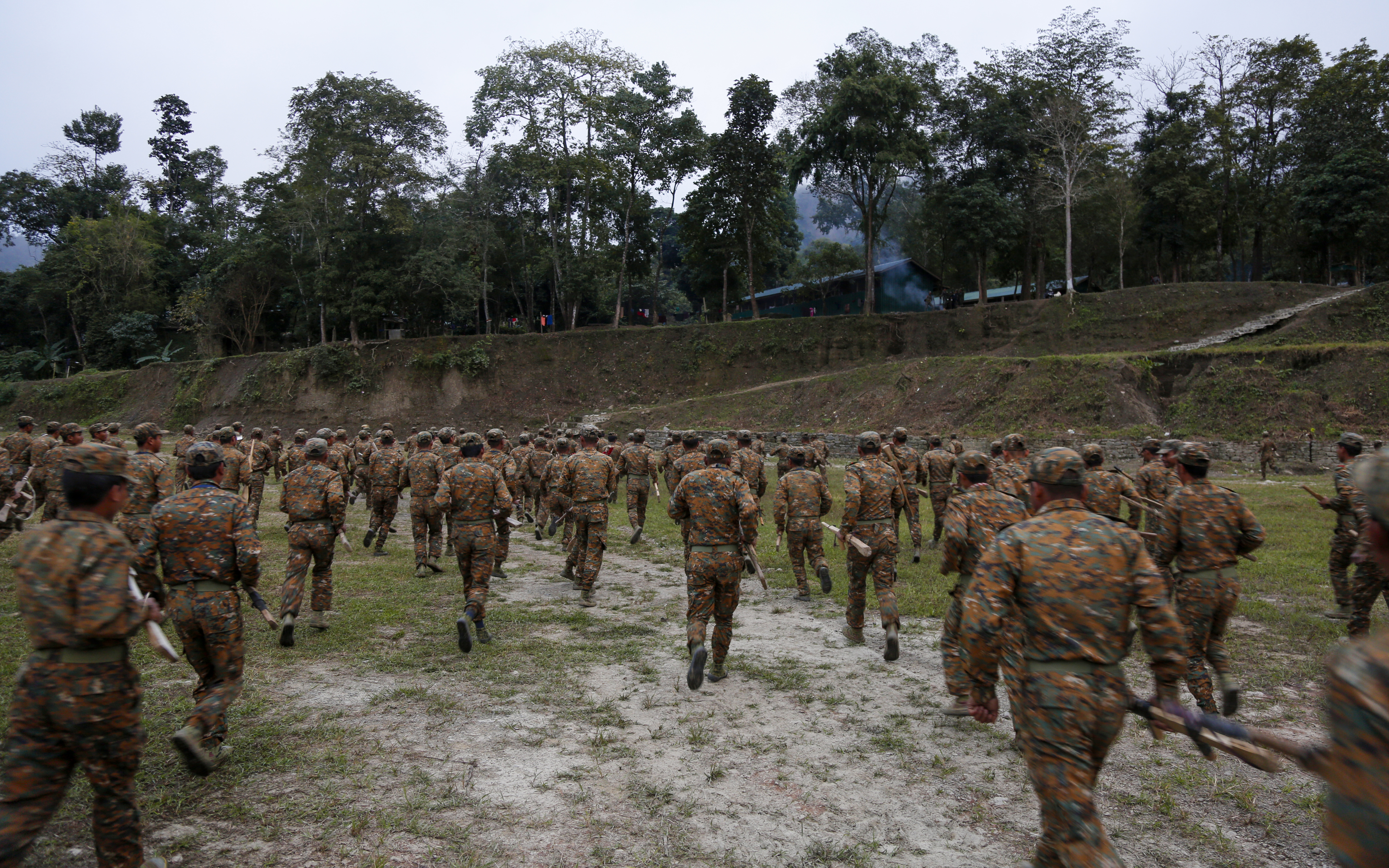Members of the Chin National Army train at their headquarters of Camp Victoria 