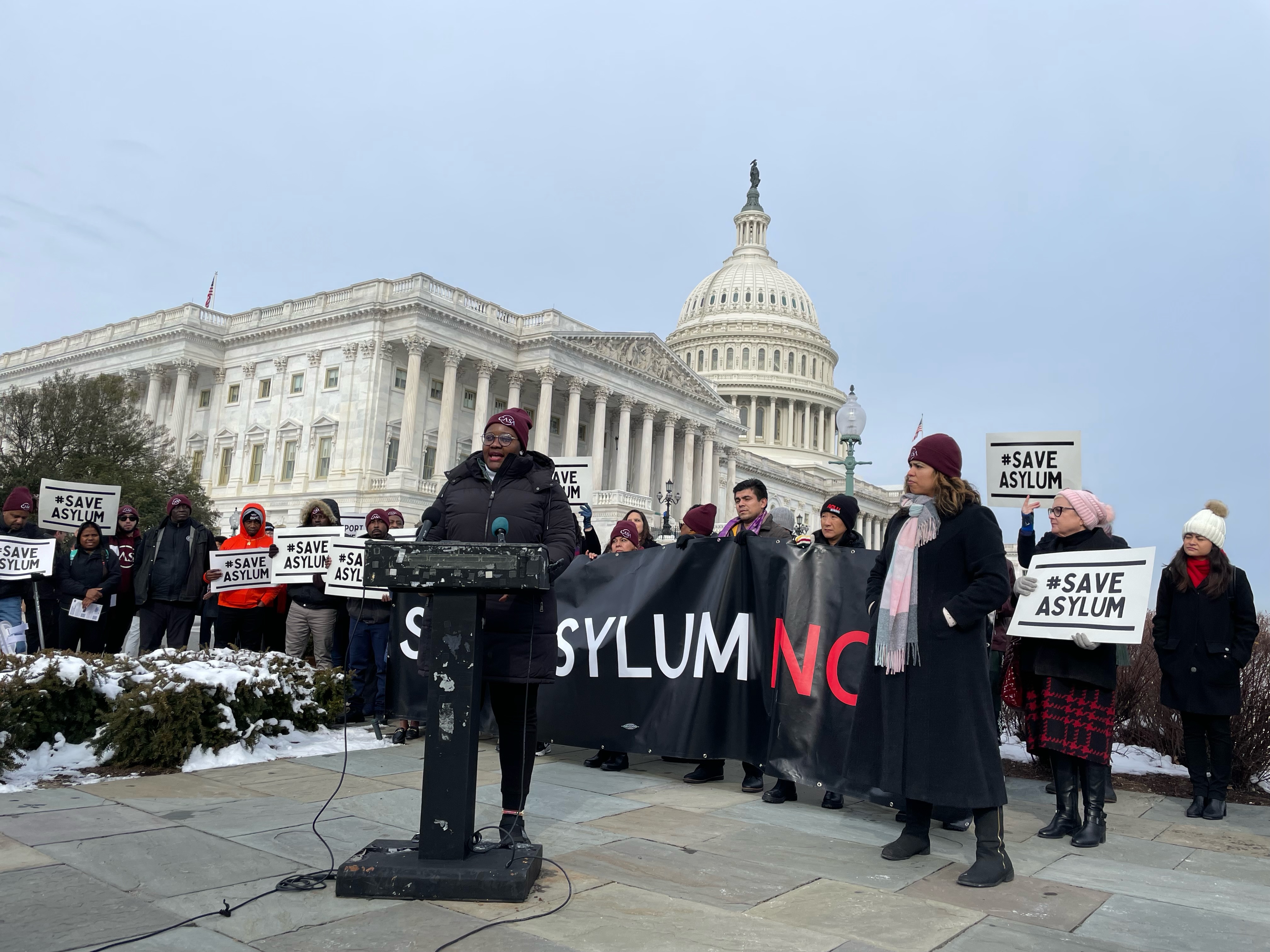 Ornela Medom, an asylum seeker from Cameroon, addresses a news conference at the US Capitol