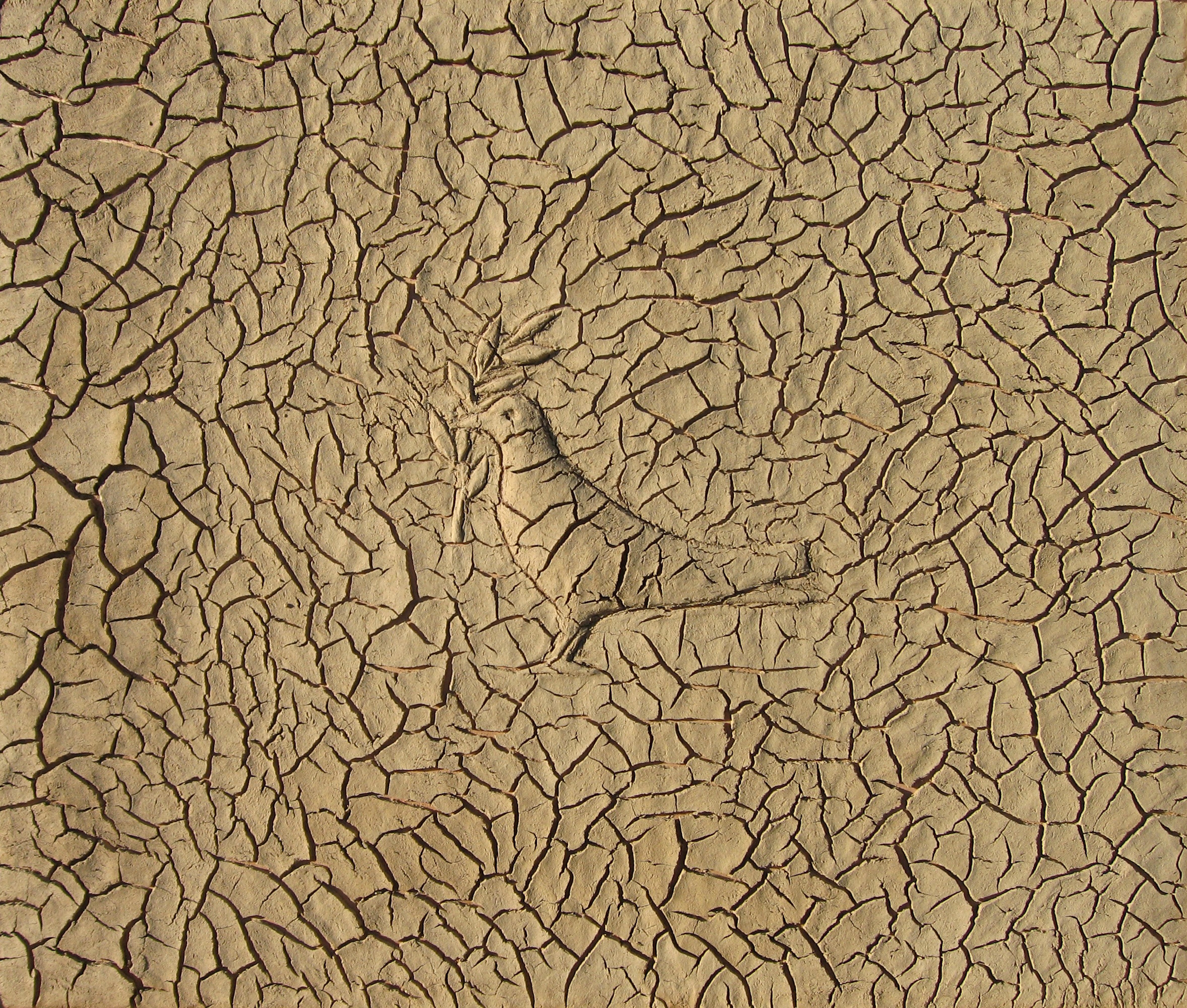 Peace, by Sliman Mansour, was created with mud and wood. [Courtesy of Sliman Mansour]