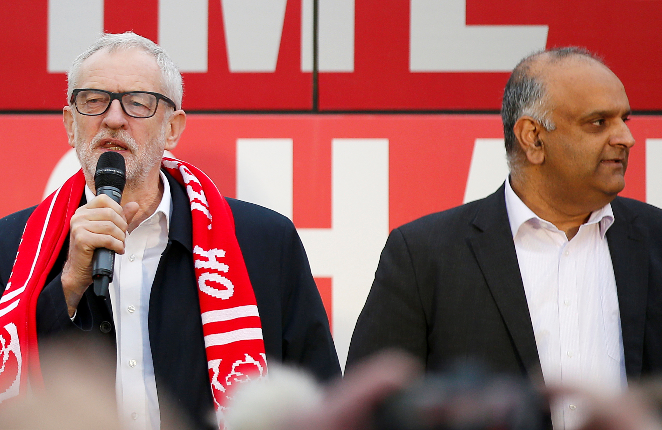 The UK’s opposition Labour Party leader, Jeremy Corbyn speaks beside the then-Labour candidate for Pendle, Azhar Ali, during a general election campaign event in Nelson, UK, on December 10, 2019
