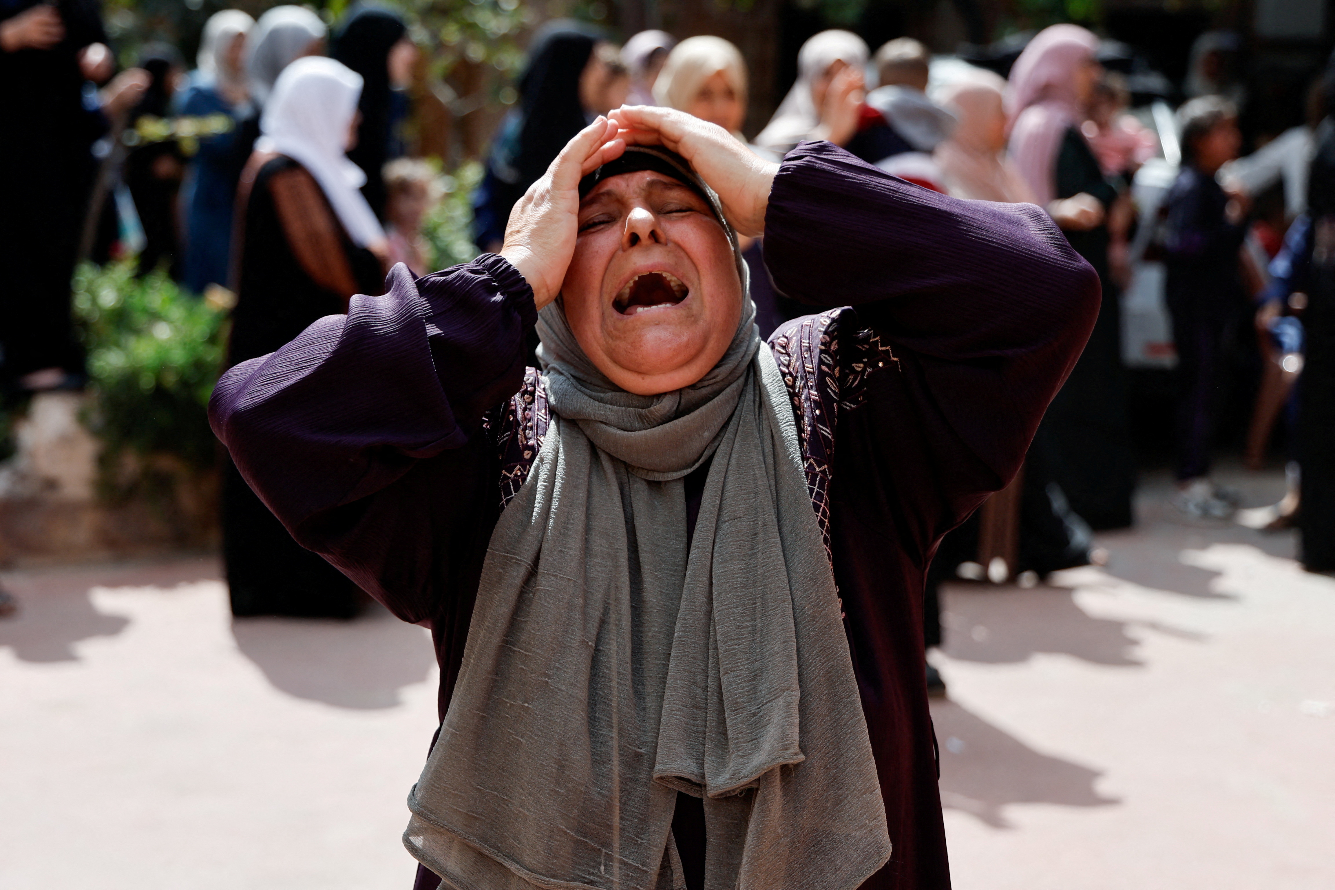 A woman reacts as mourners attend the funeral of four Palestinians killed in clashes with Israeli settlers, near Nablus in the occupied West Bank, October 12, 2023