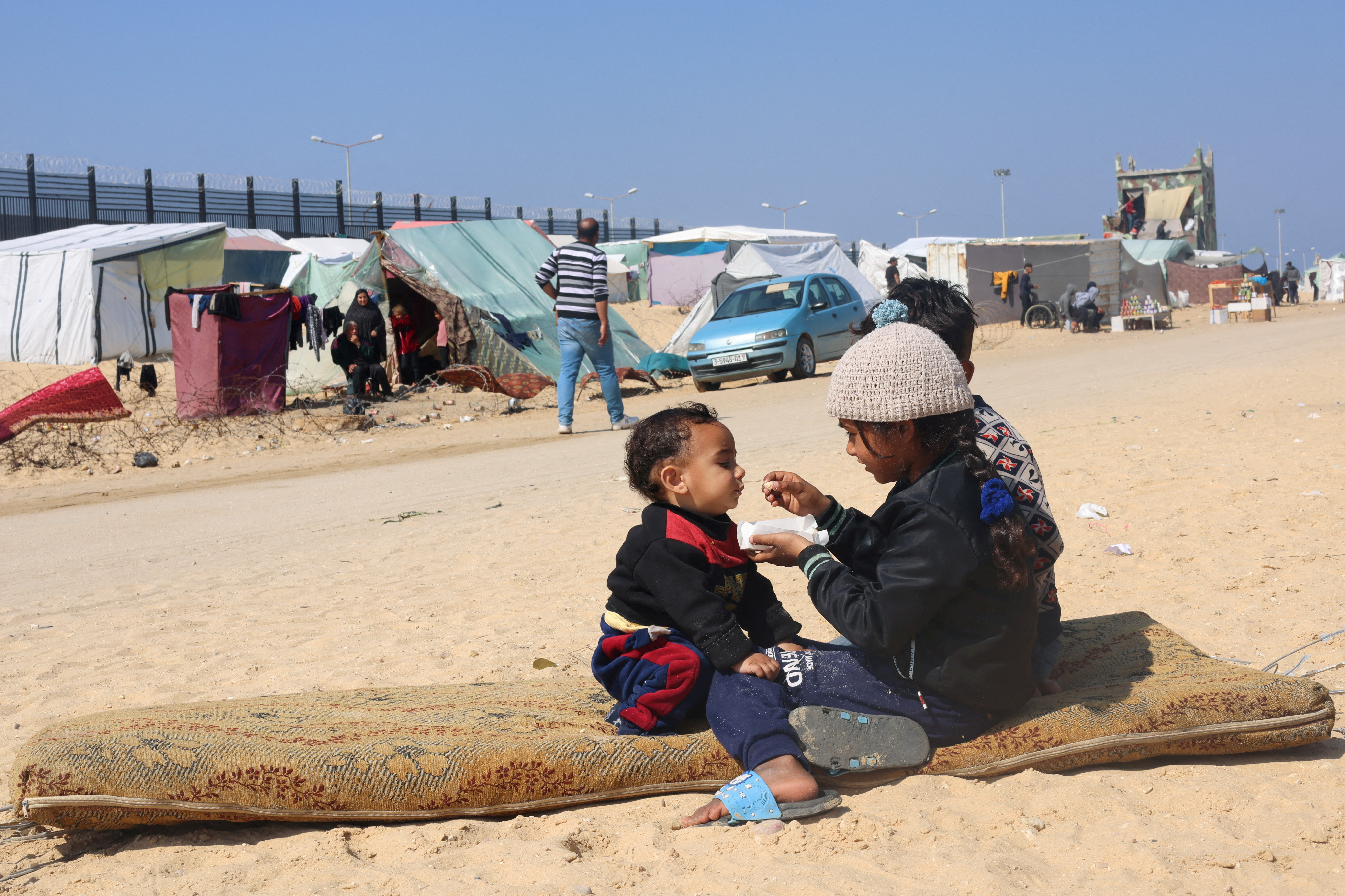 Israel plans to build more than 3,300 new homes in settlements in the Israeli-occupied West Bank in response to a fatal Palestinian shooting attack, a senior Cabinet minister said. The decision drew an angry response from the U.S. at a time of growing tensions over the course of Israel’s war on Hamas in the Gaza Strip.