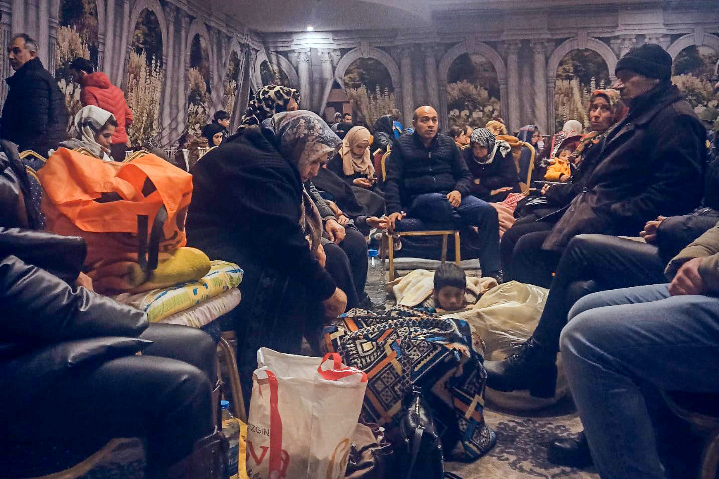 Earthquake survivors huddled in one of the opulent wedding halls