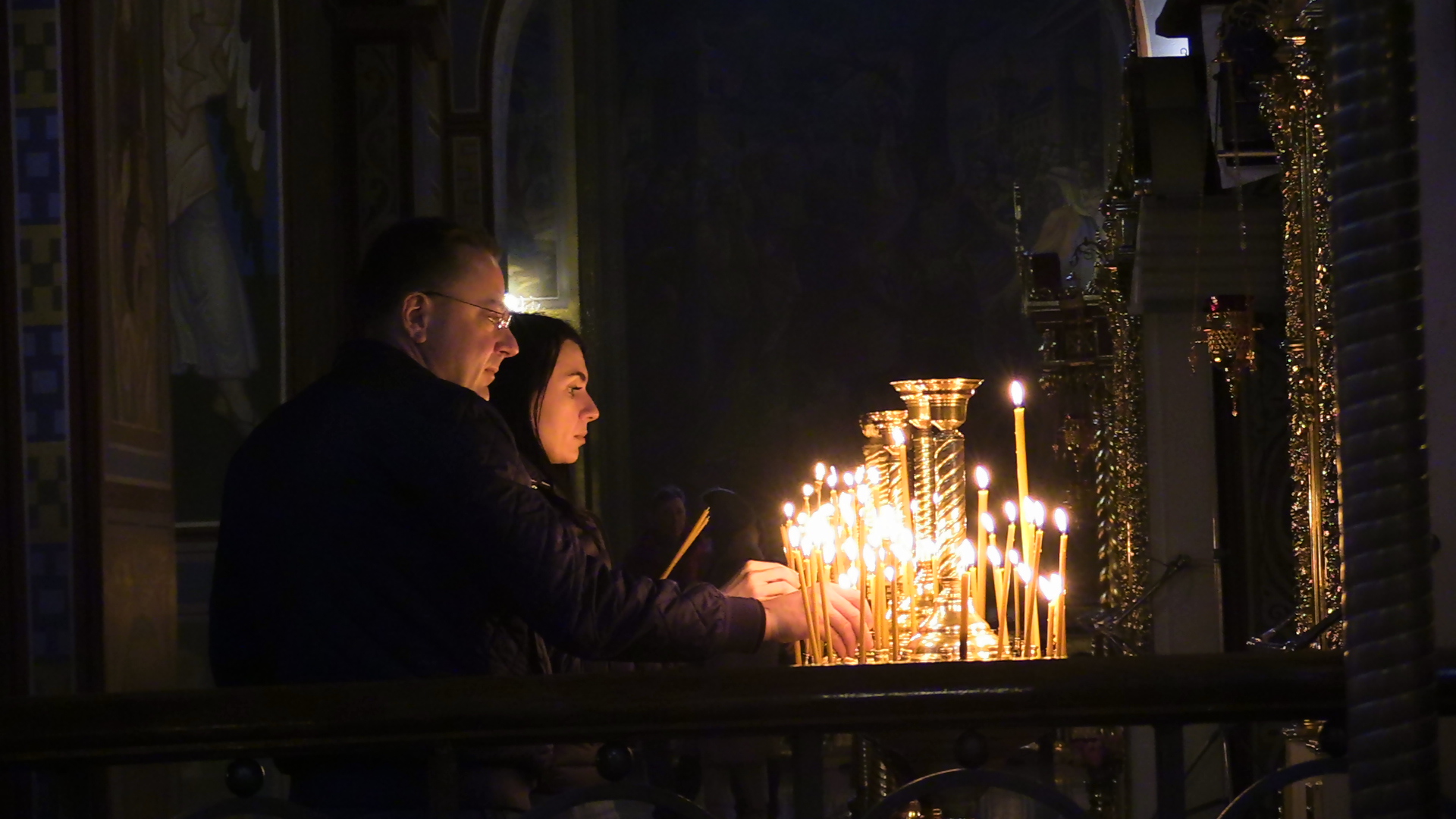 A Ukrainian couple light candles on Holy Saturday in St Michael’s Monastery in Kyiv in April 2023