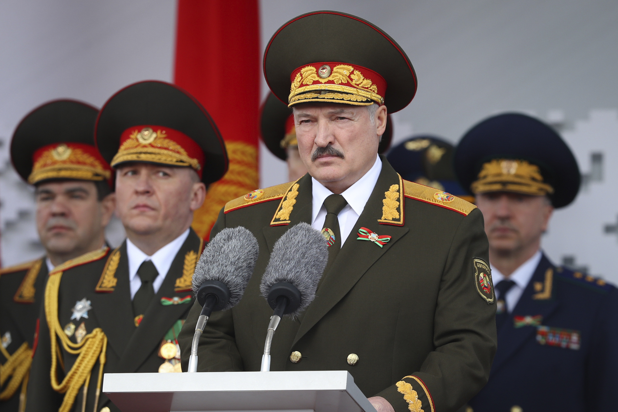 FILE - Belarusian President Alexander Lukashenko, center, gives a speech during a military parade that marked the 75th anniversary of the allied victory over Nazi Germany, in Minsk, Belarus, on May 9, 2020. Belarusians will cast ballots Sunday in tightly controlled parliamentary and local elections that are set to cement an authoritarian leader's rule, despite calls for a boycott by an opposition leader who described the balloting as a "senseless farce." (Belarusian Presidential Press Service via AP, File)