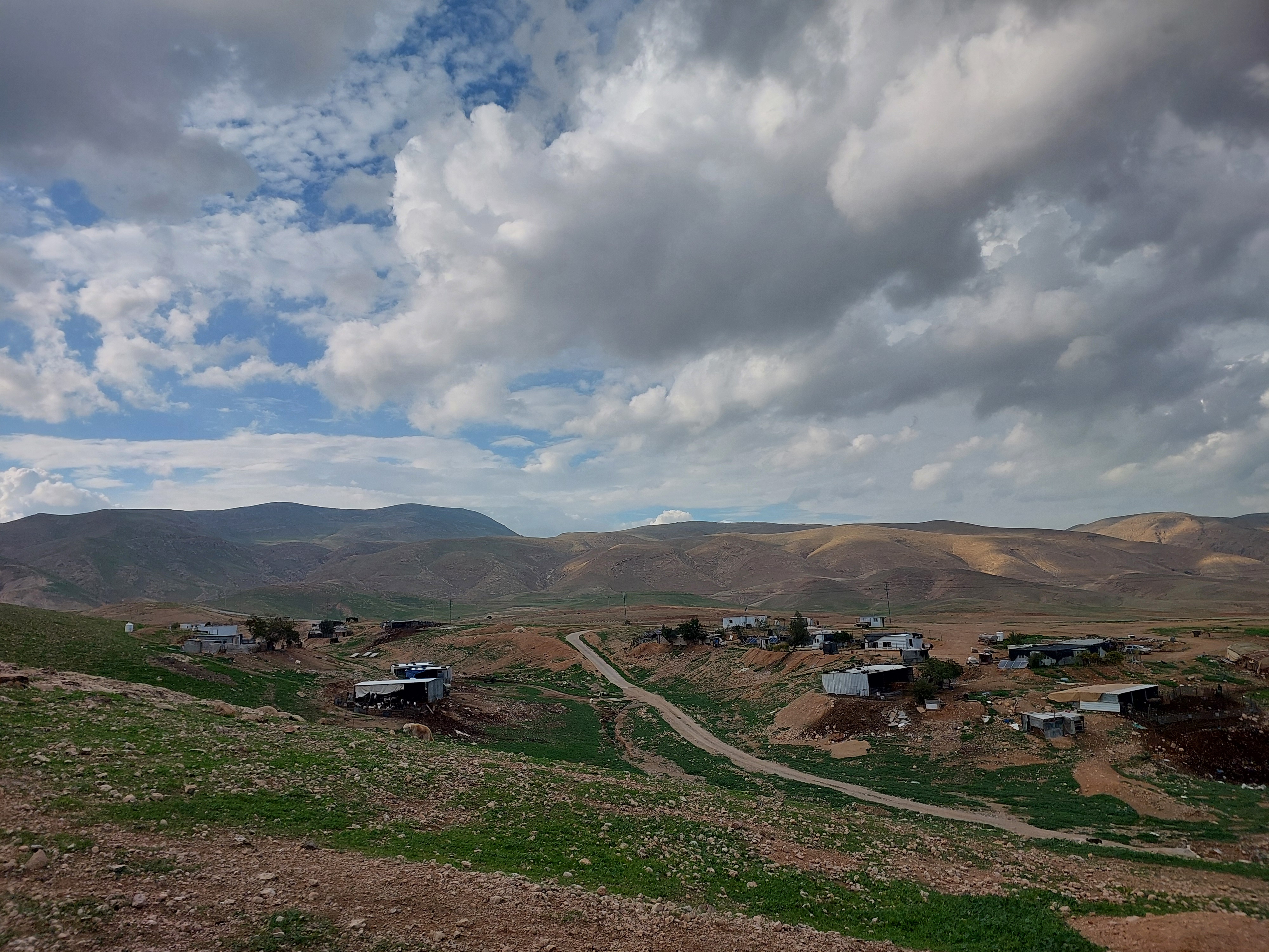 The Bedouin community of Maarajat sits nestled at the foot of a smooth hill