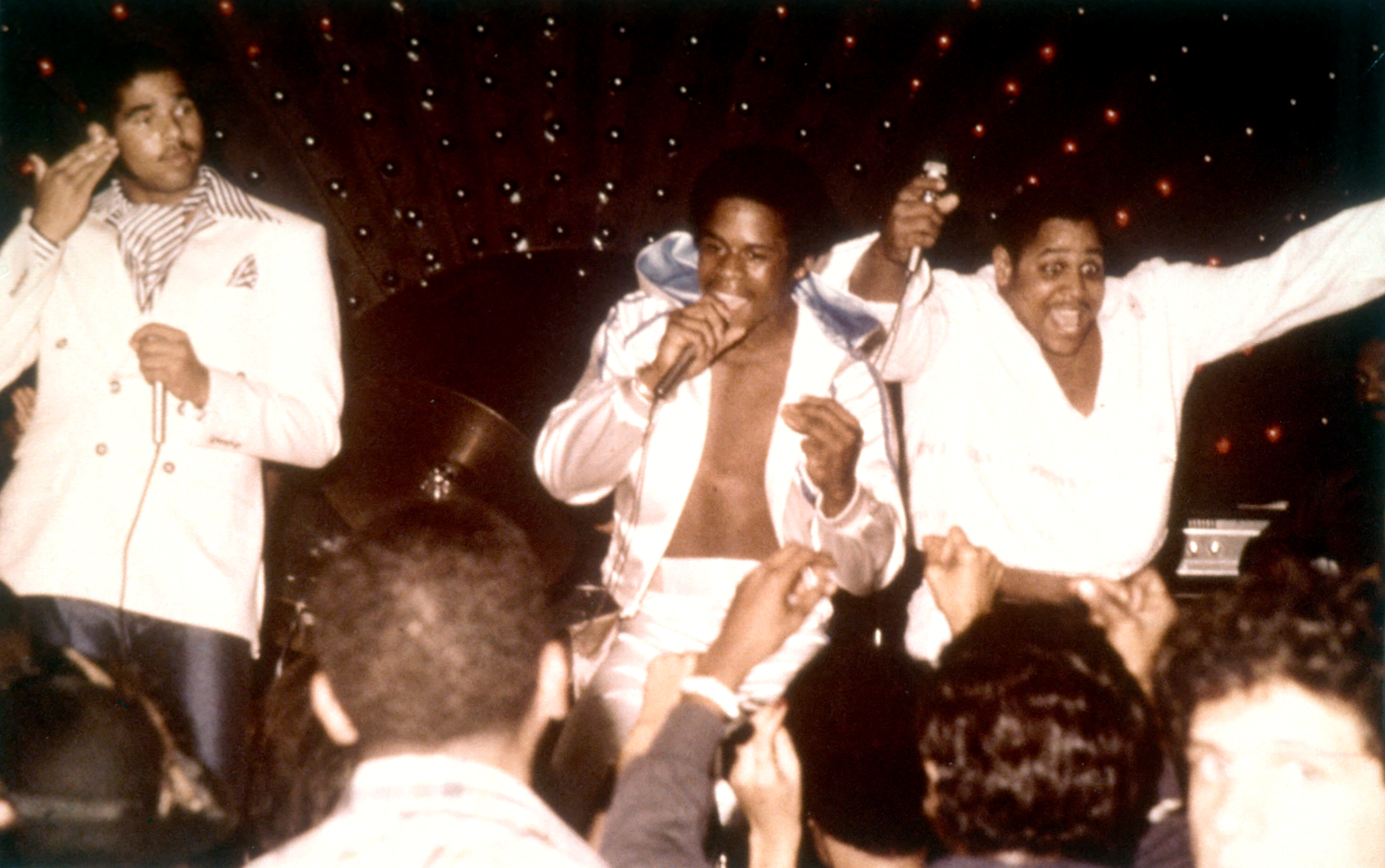 The Sugarhill Gang (L-R: Wonder Mike, Master G and Big Bank Hank), credited with introducing hip-hop to an audience beyond New York, perform live in 1979 [Michael Ochs Archives via Getty Images]