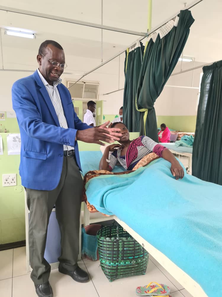 Solwayo Ngwenya attends to a patient at Mpilo Hospital in Bulawayo, Zimbabwe