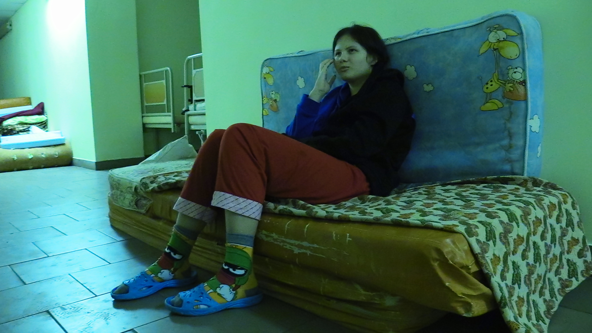 Nadia Tymoshchuk, 14, hides from Russian bombing in the basement of a Kyiv hospital in March 2022