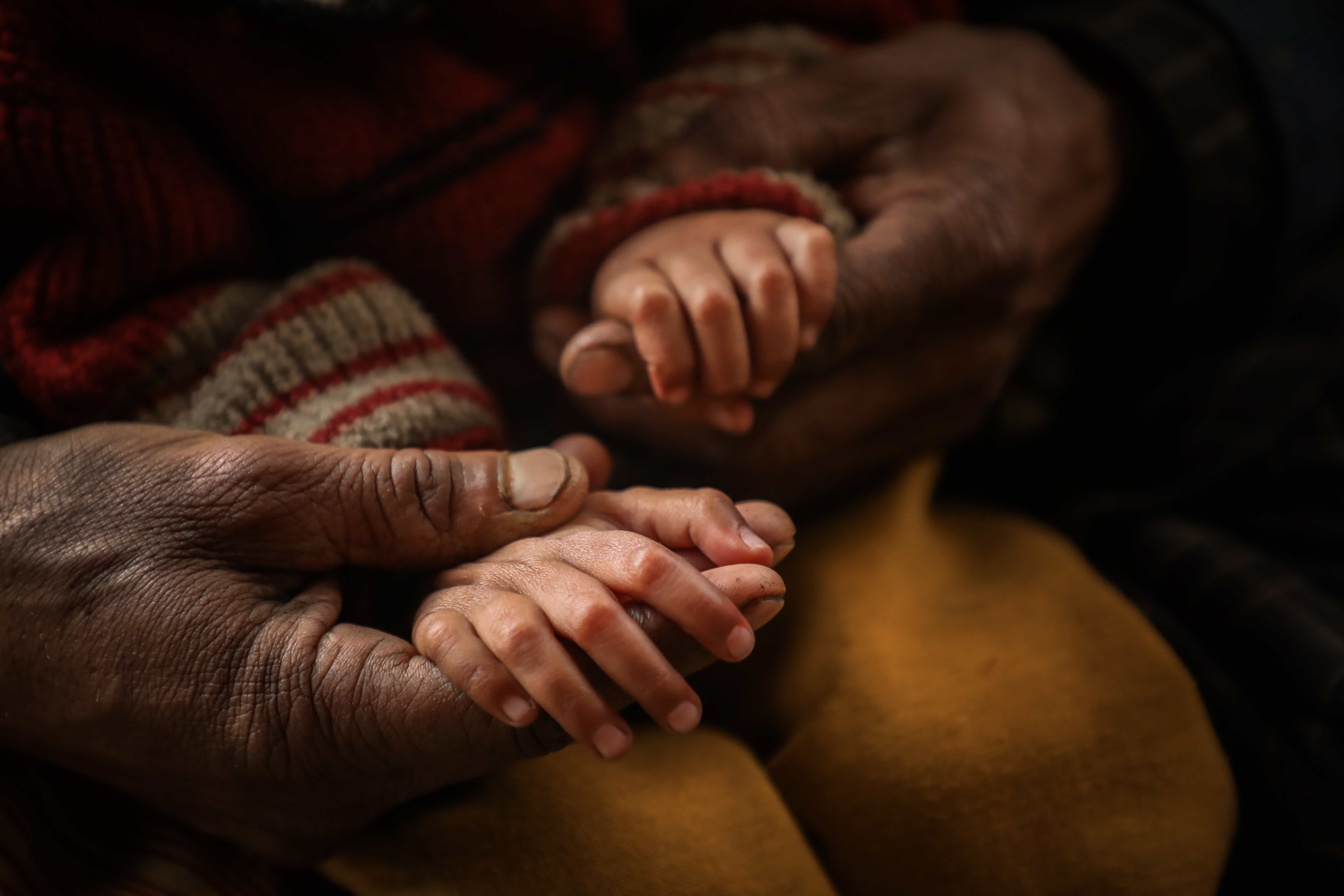The hands of seven-year-old Iram Fatima, who is deaf-mute, are much smaller than usual for a child her age