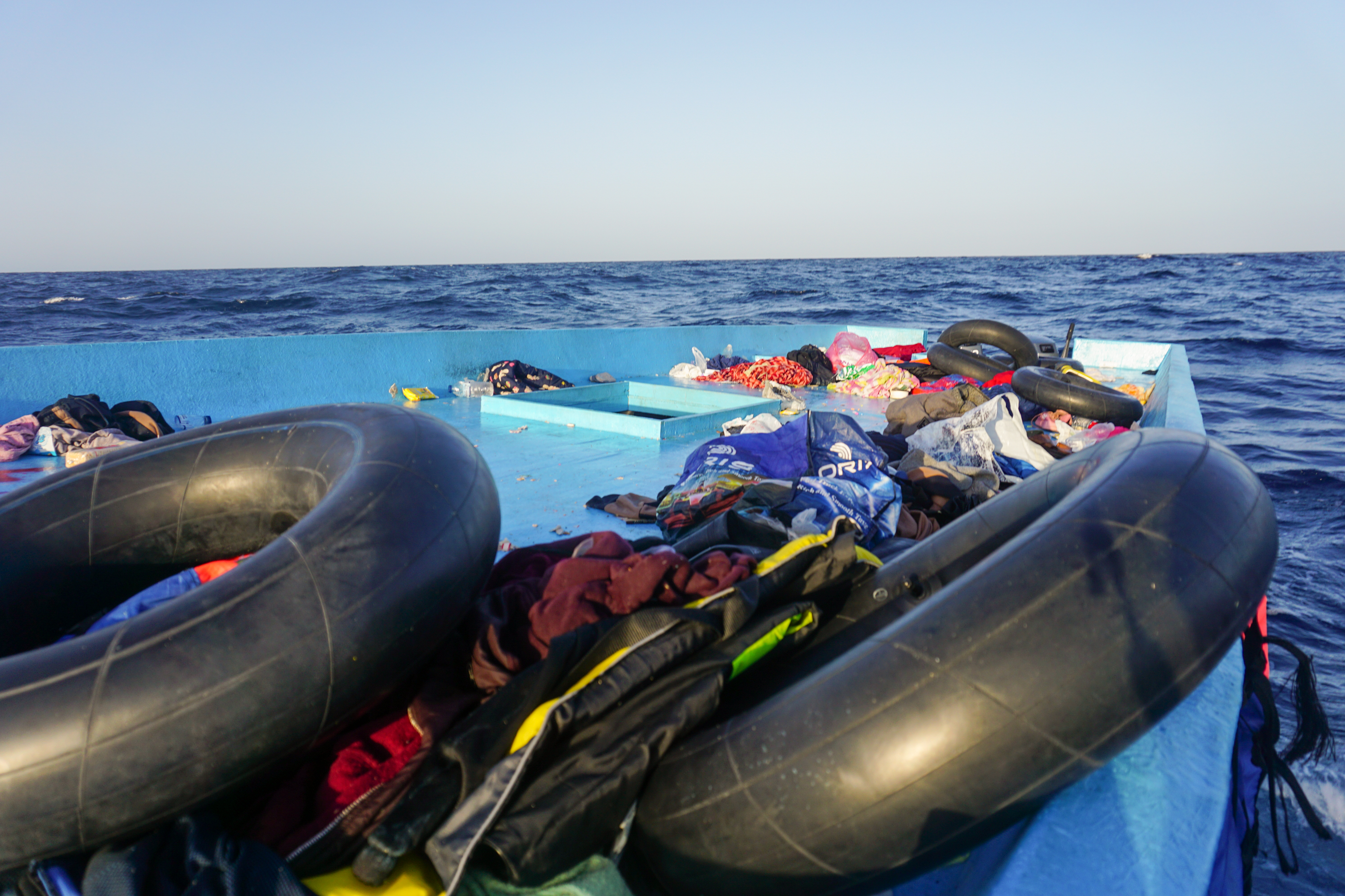 The blue boat that the two men boarded with 124 other desperate people