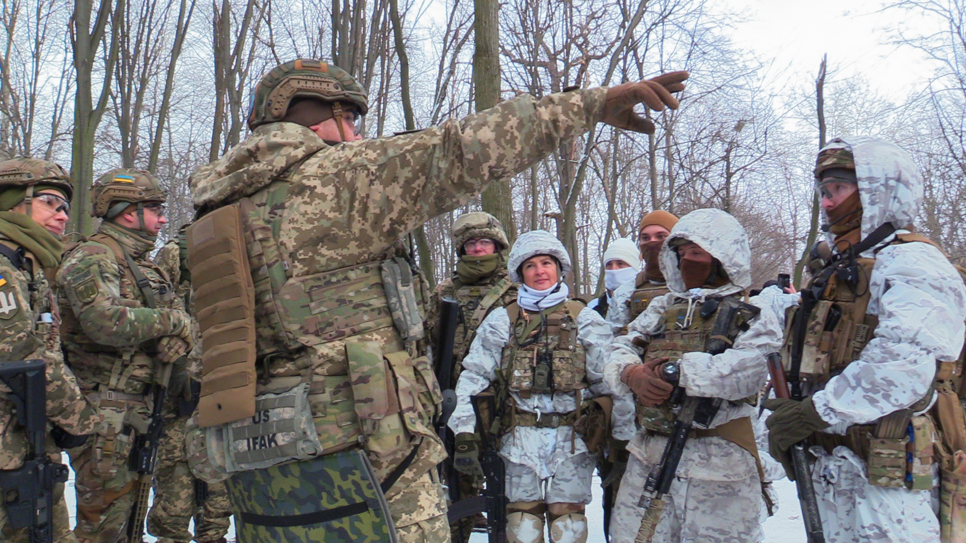 Ukrainian civilians take part in a military drill in Kyiv a month before the war began