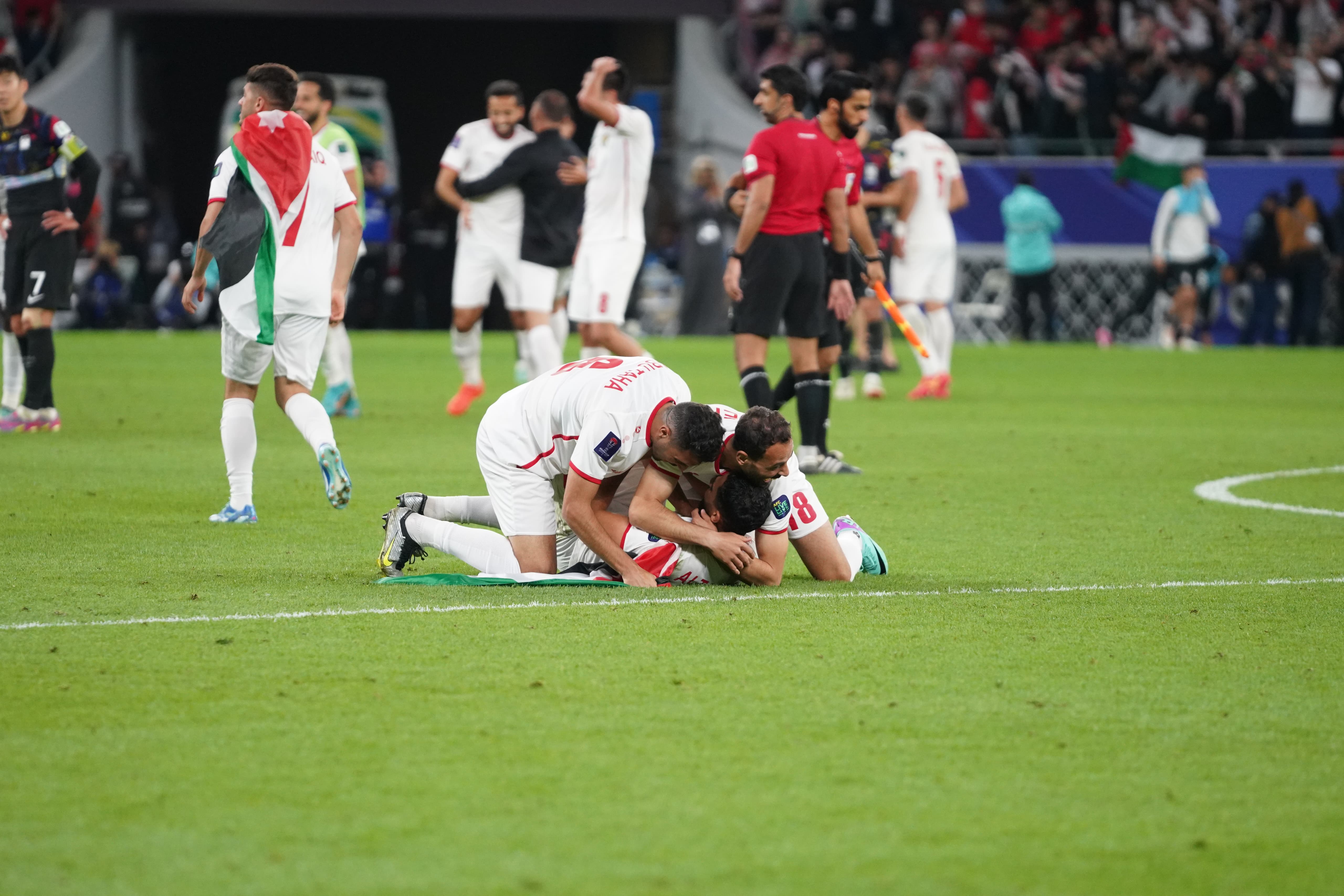 Jordan players celebrate after winning the match