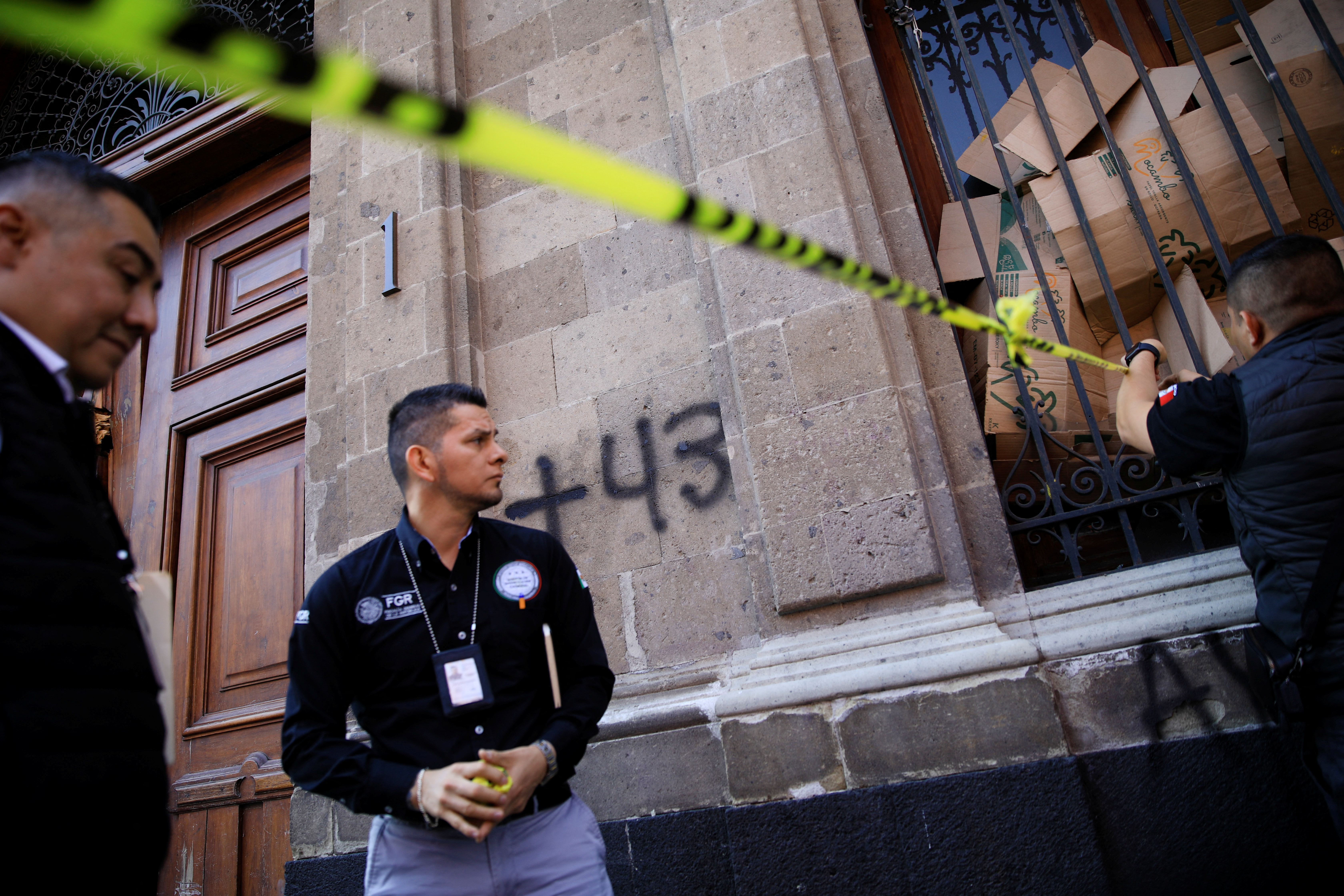 Members of the Attorney General’s Office cordon off the area after the protest in Mexico City, Mexico, March 6, 2024