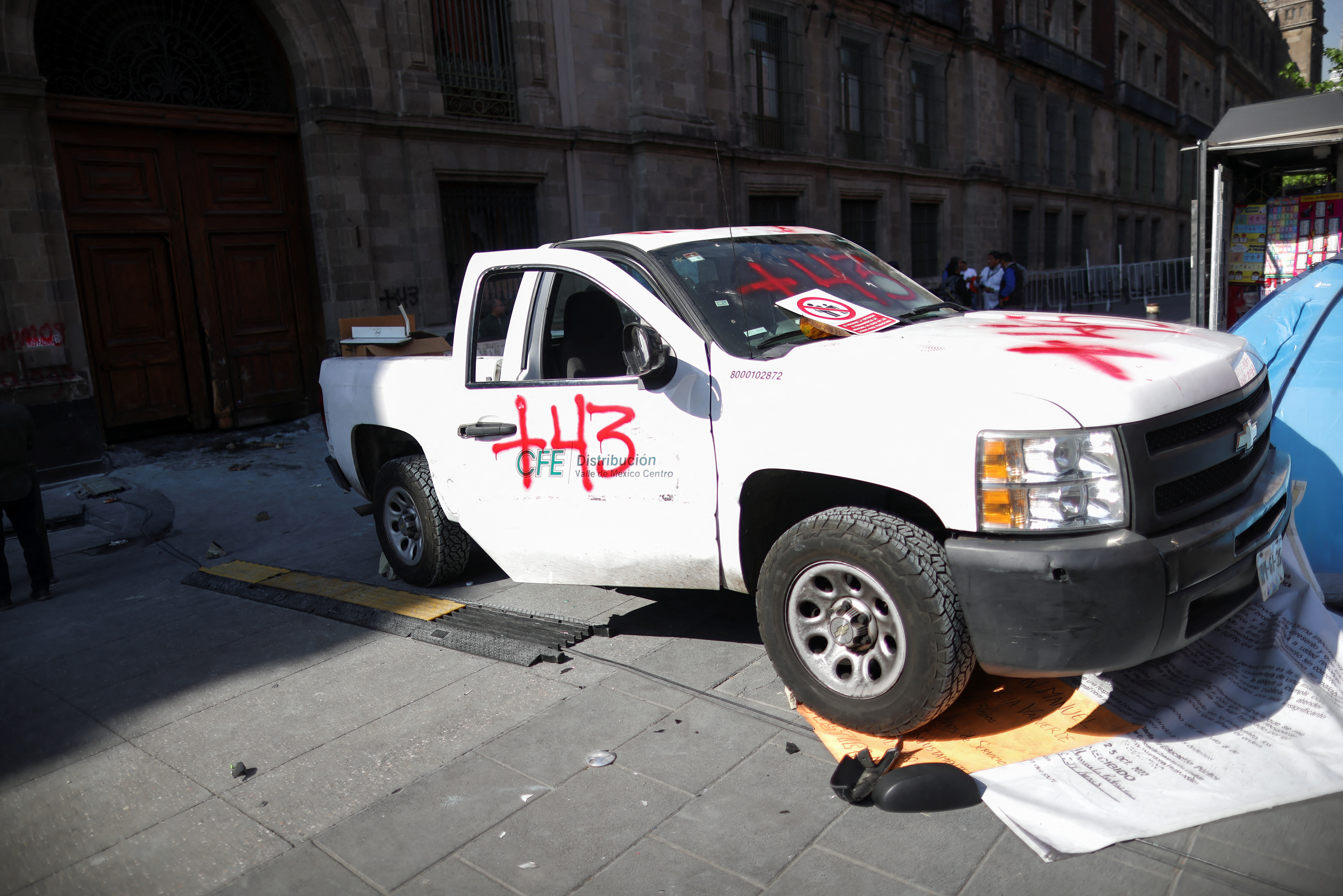 Graffiti is displayed on the vehicle used to ram the door of the National Palace in Mexico City, Mexico, on March 6