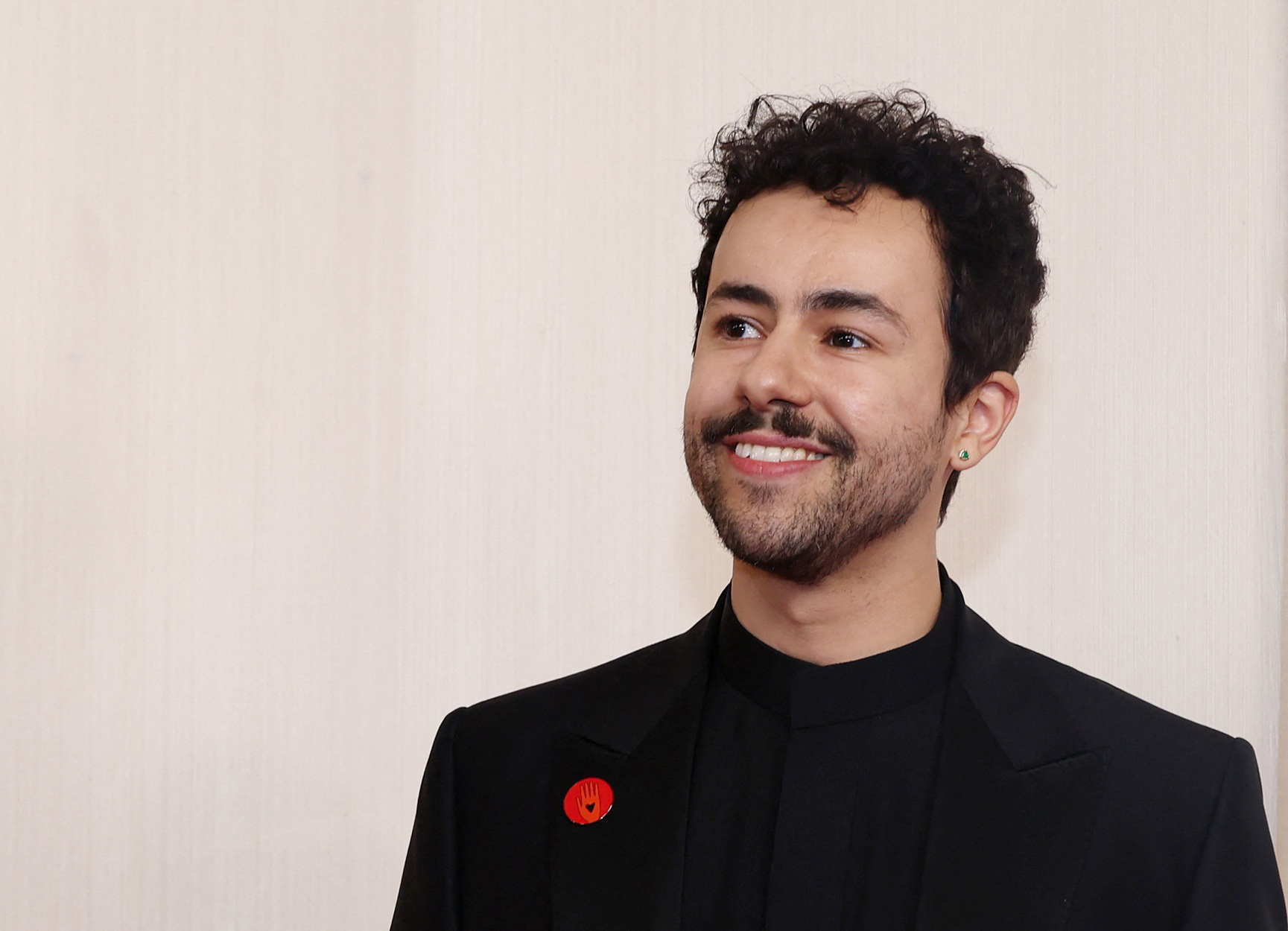 Ramy Youssef poses on the red carpet during the Oscars arrivals at the 96th Academy Awards in Hollywood