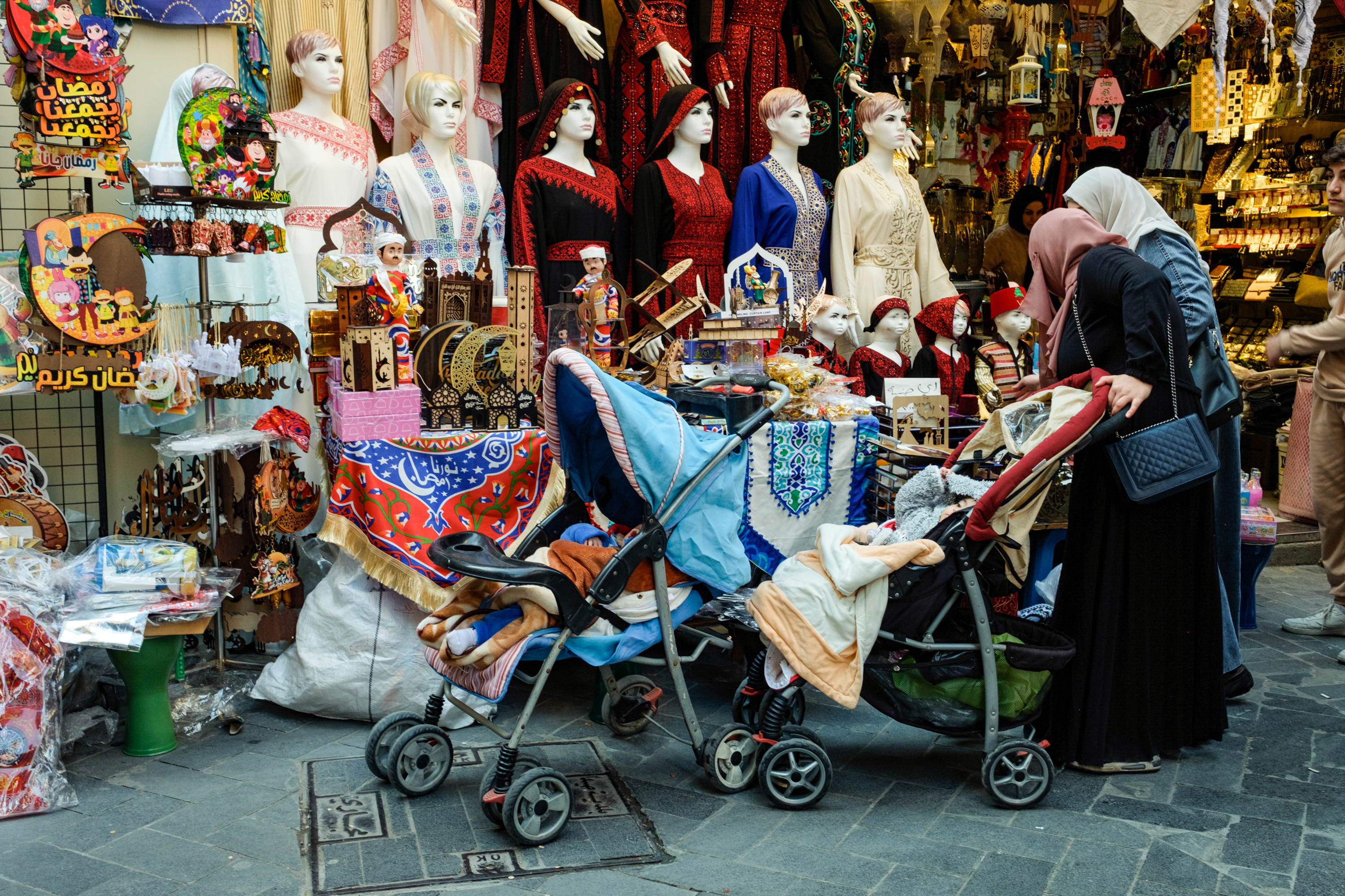 Shoppers browsing in Sidon’s Old Souk, which is quiet, so far