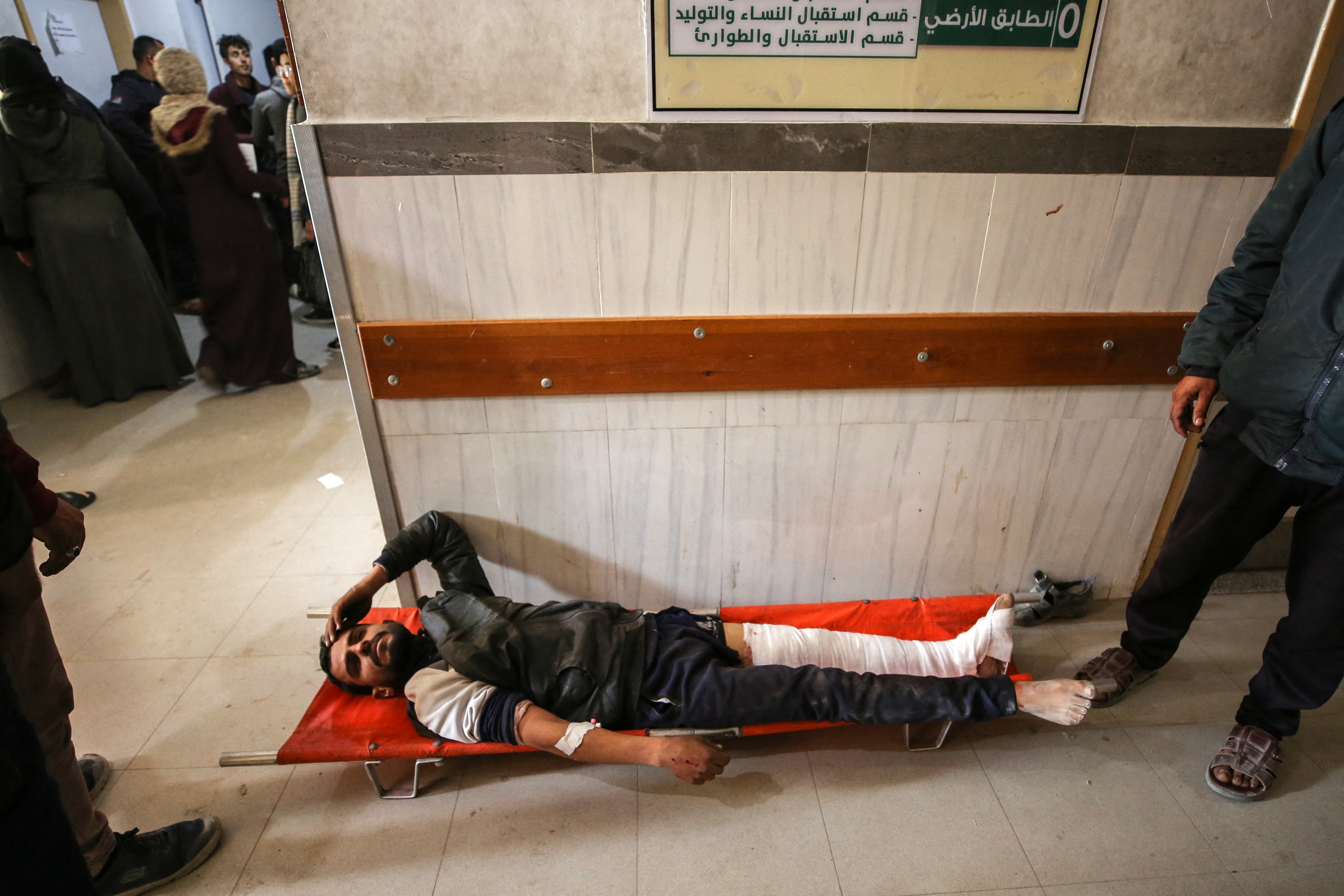 Palestinians receive medical care at Kamal Edwan Hospital in Beit Lahia, in the northern Gaza Strip, on February 29, 2024, after Israeli soldiers allegedly opened fire at Gaza residents who rushed towards trucks loaded with humanitarian aid amid ongoing battles between Israel and the militant Hamas group. - A Gaza emergency doctor said on February 29 that Israeli forces shot dead at least 50 people who rushed towards trucks loaded with humanitarian aid for Gaza City residents. The Israeli army said it was "checking" the reports on the incident, while the United Nations' humanitarian office OCHA said it was "familiar with the reports". (Photo by AFP)