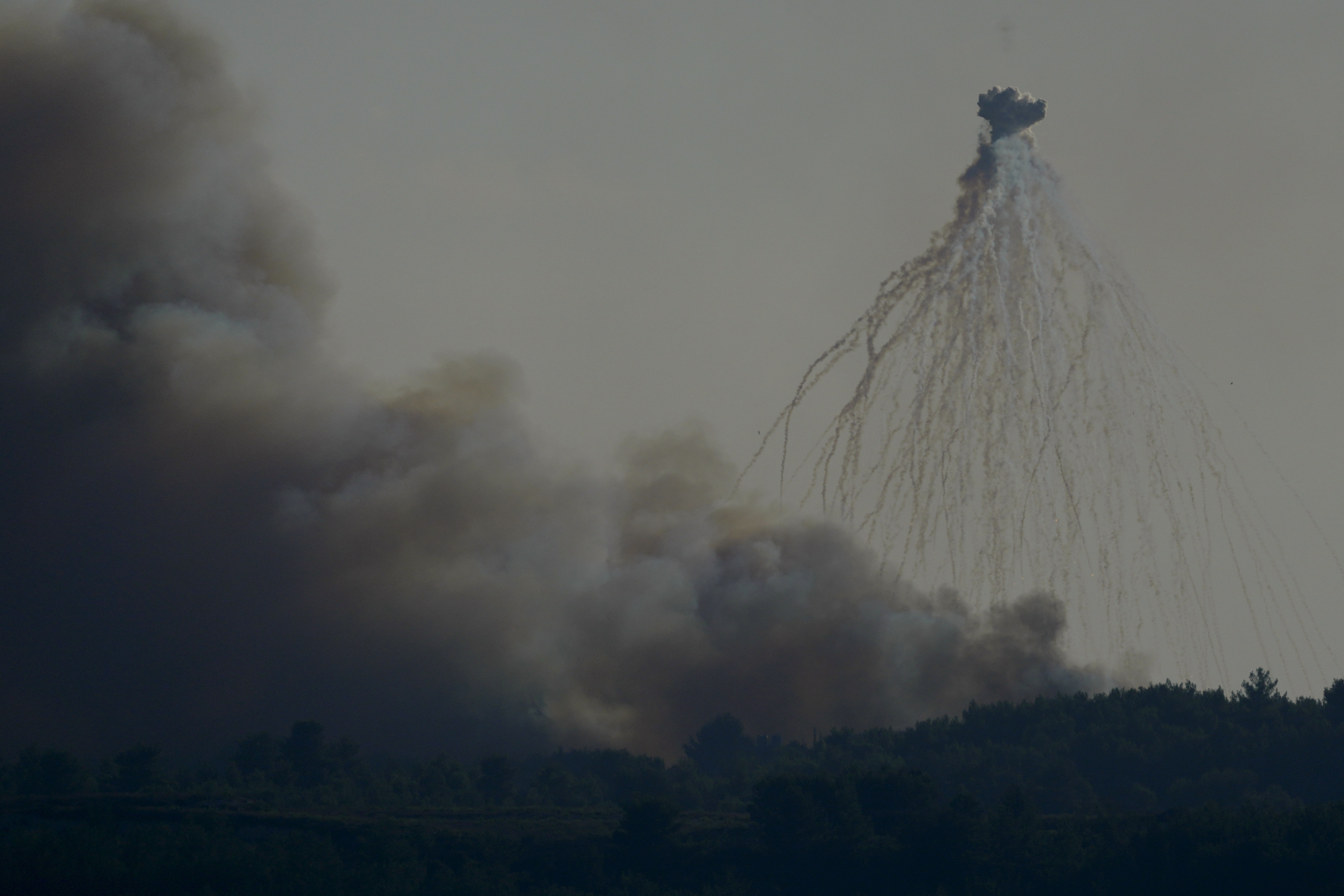 A shell from Israeli artillery explodes over the border line at the Alma al-Shaab